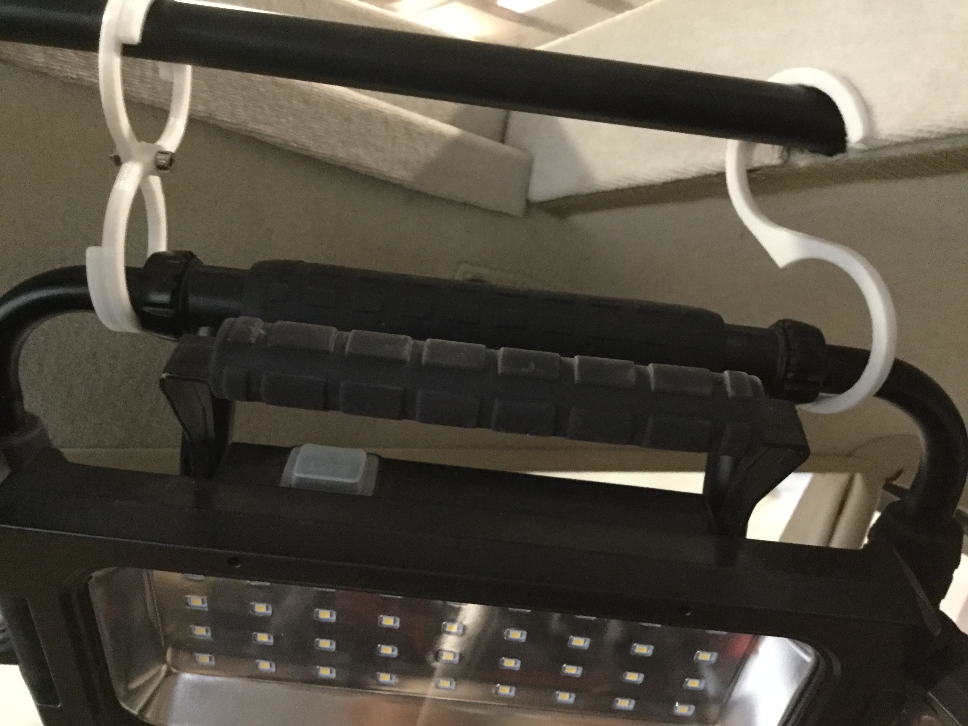 Multipurpose hooks for shop light.