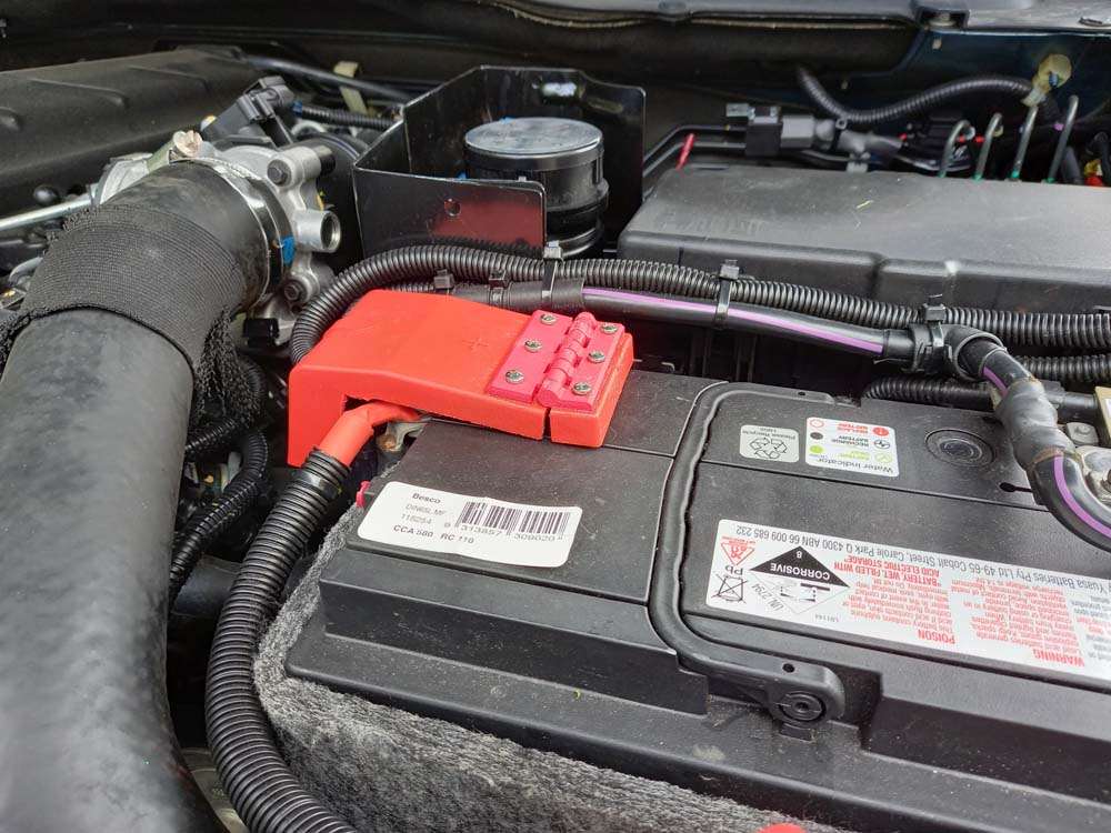 Hinge to repair battery terminal cover