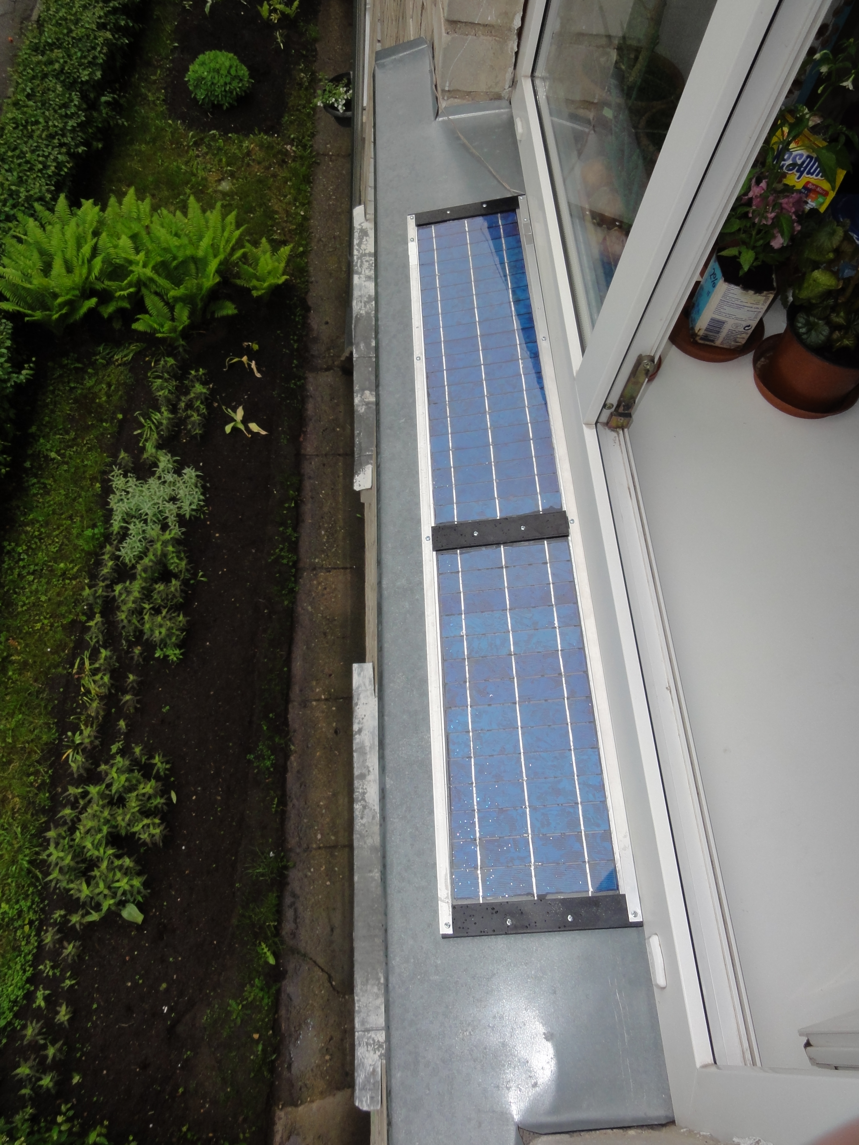 Window sill solar panel (urban environment)