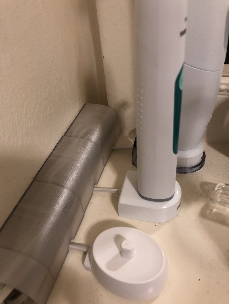Wire cord cover for hiding charging station cables