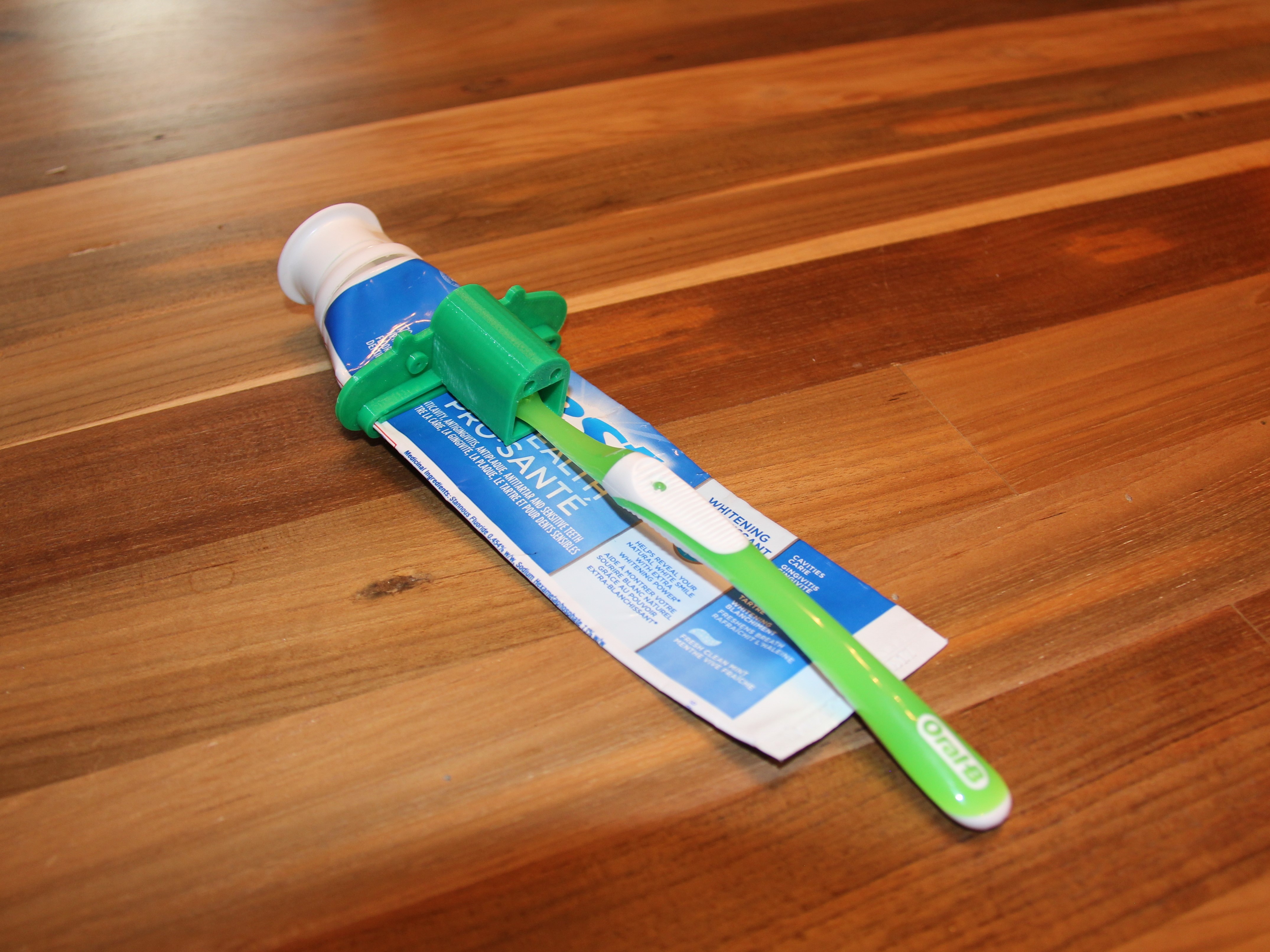 Paste Pusher with Toothbrush Holder