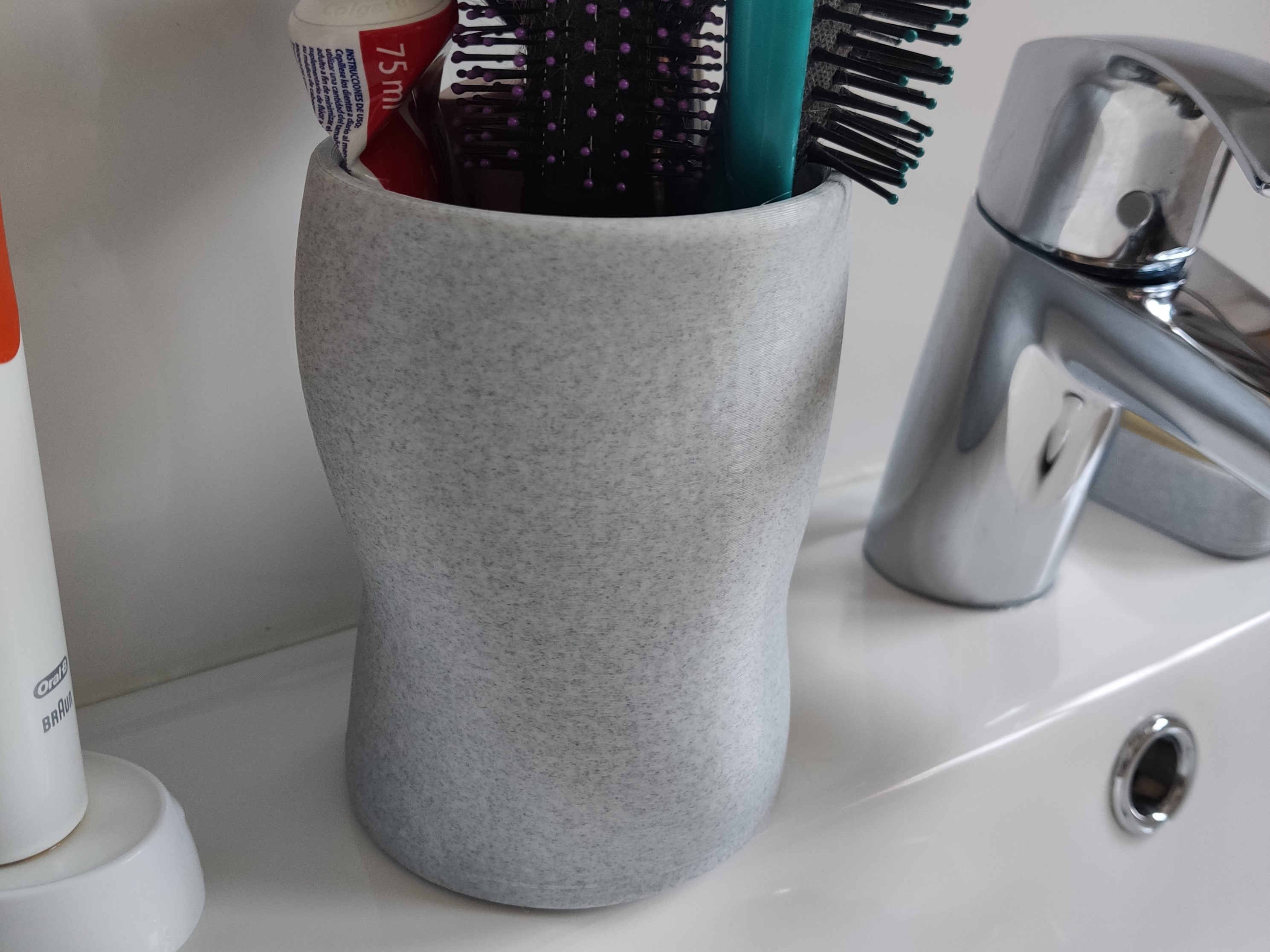Deformed cup for bathroom sink top