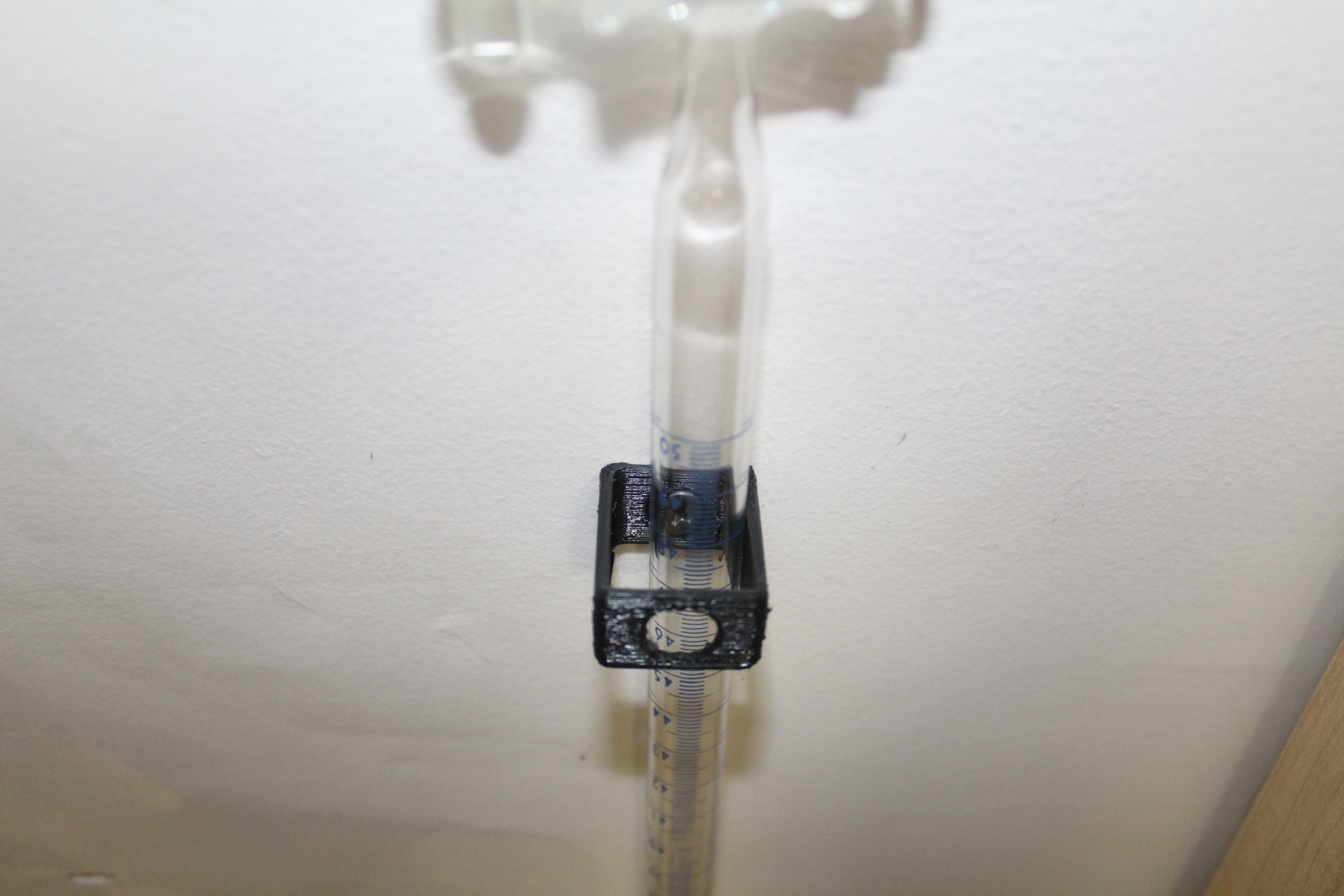Burette wall mount