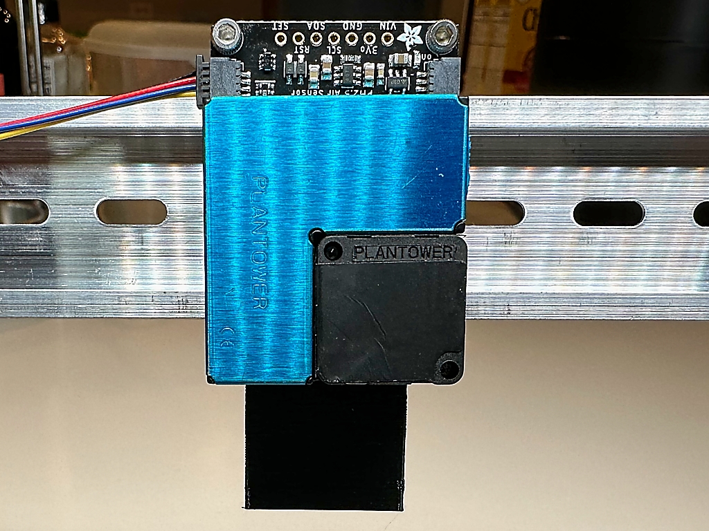 A Din Rail mount for an Adafruit PMSA003I Air Quality breakout board
