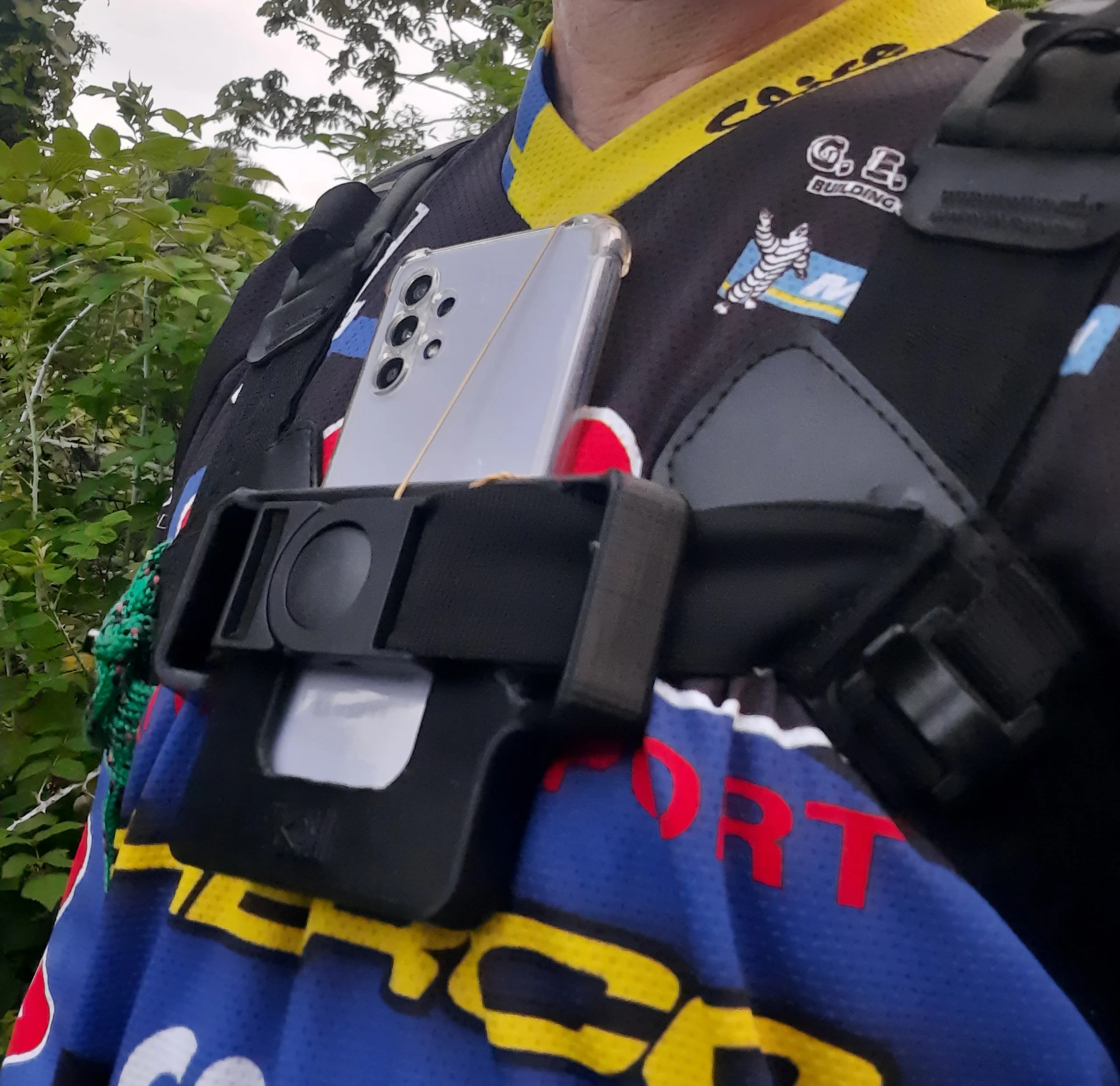Cell phone holder for backpack