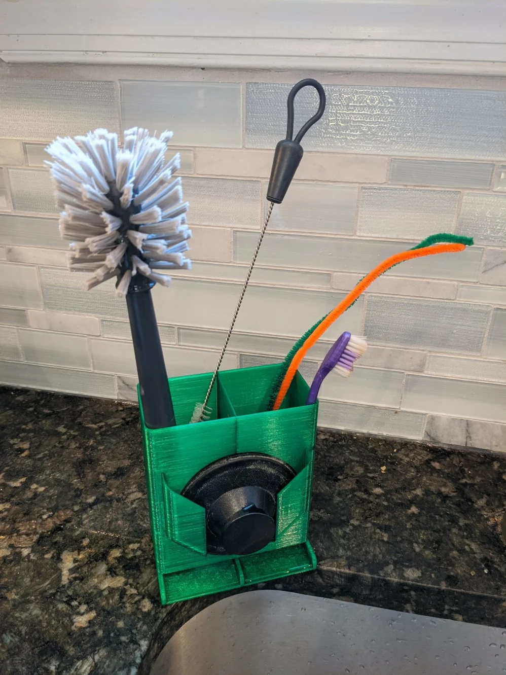 Sink organizer with Insinkerator drain plug holder