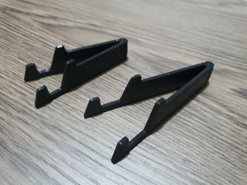 Multi-purpose holder for smartphones, accessories, frames and other accessories.
