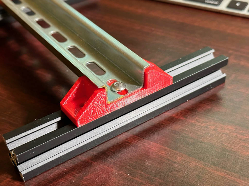 Din rail standoff for 2020 beam