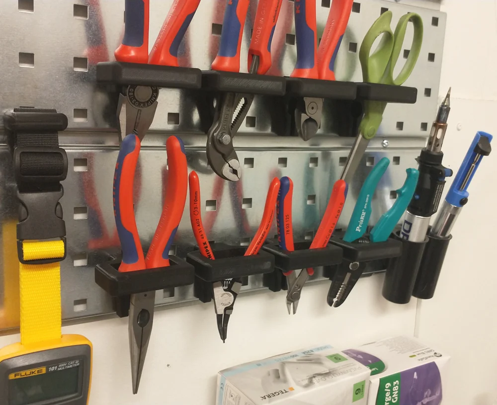 Pliers holder for a Raaco tool wall