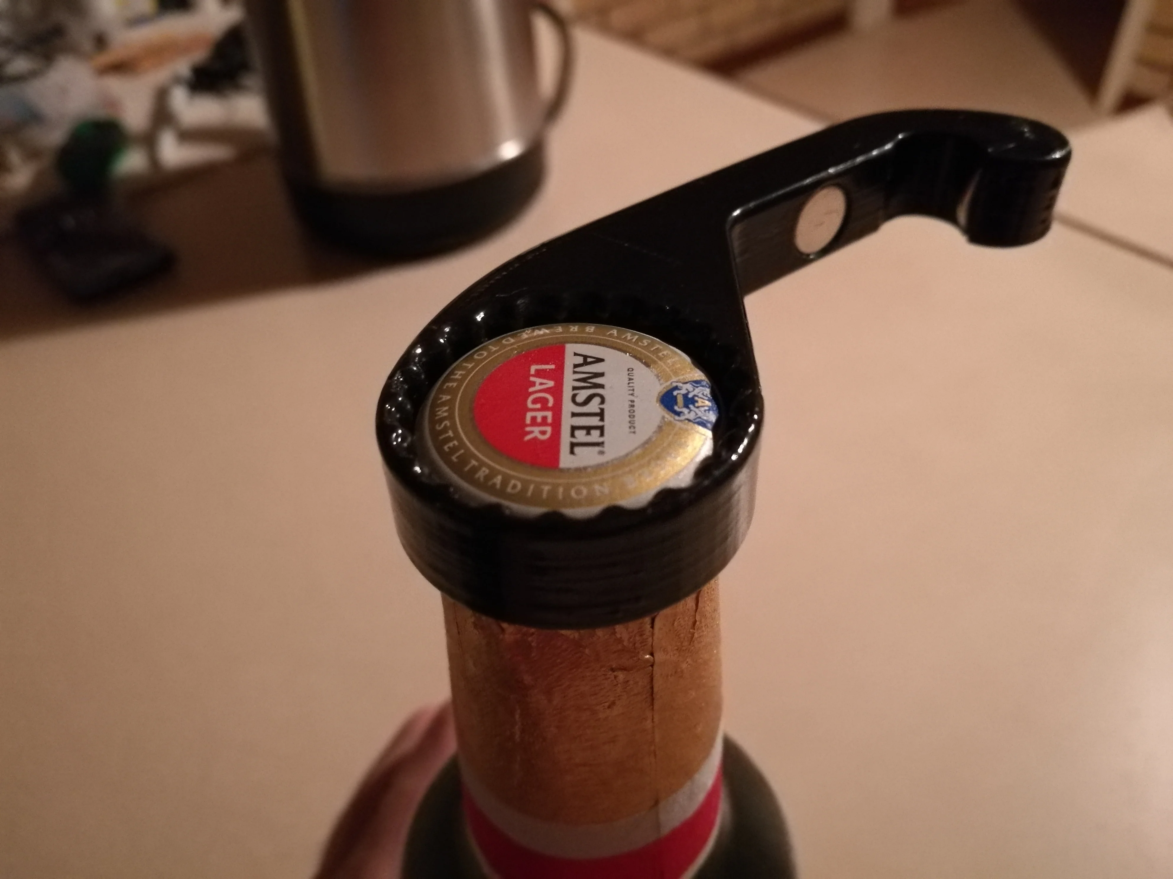 One handed bottle opener with twist off gripper