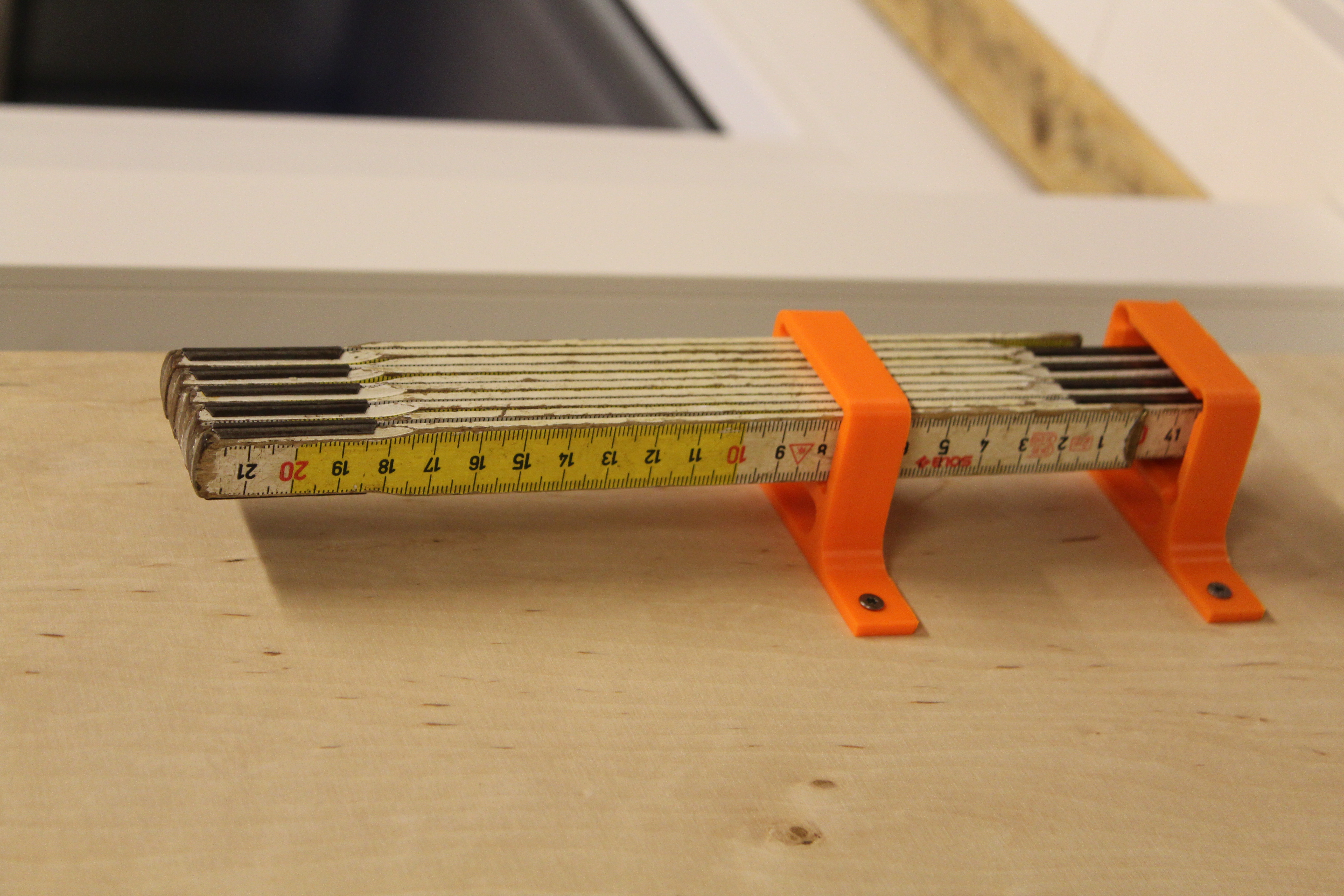 folding rule wall mount