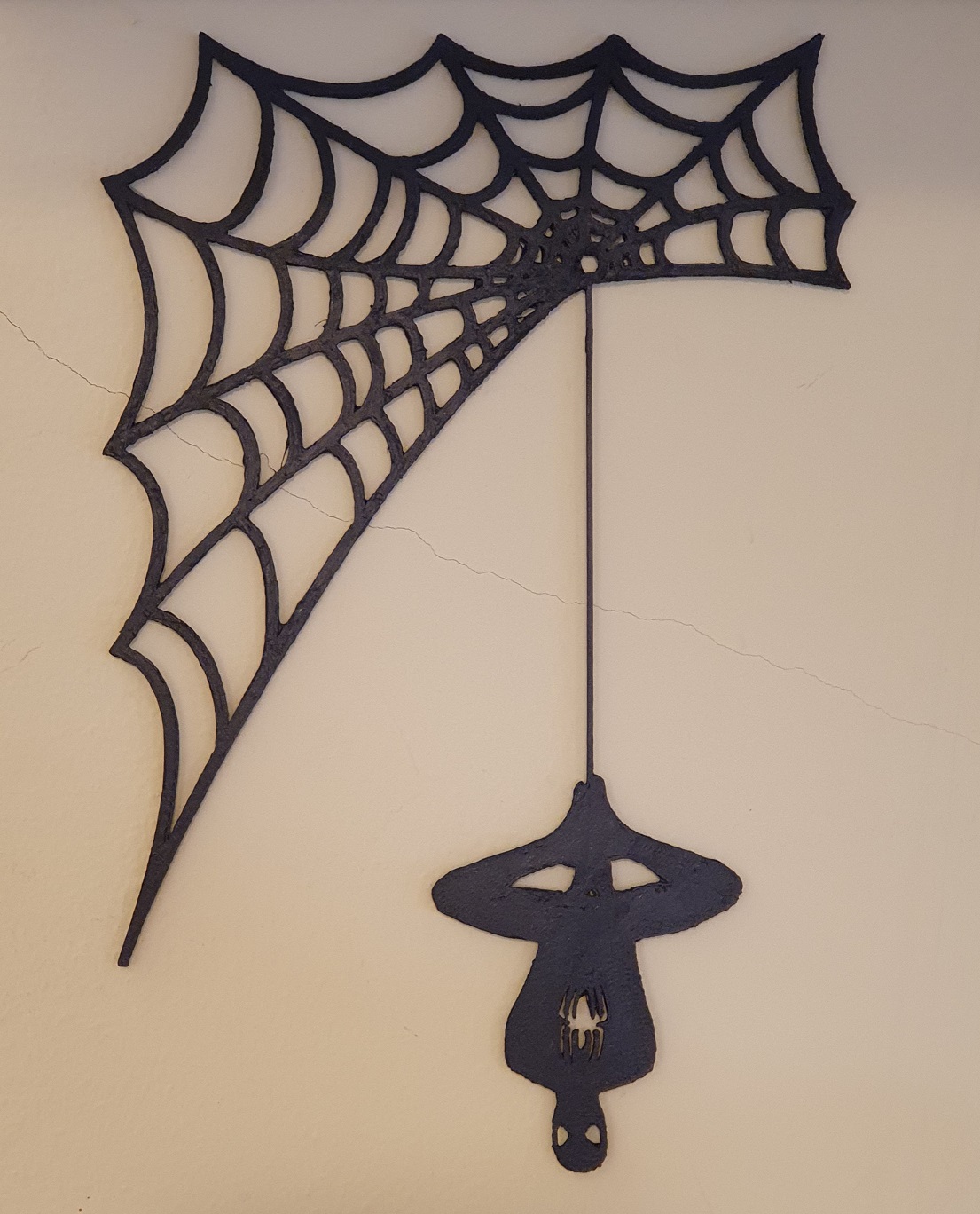 Spiderman hangs on the spider web