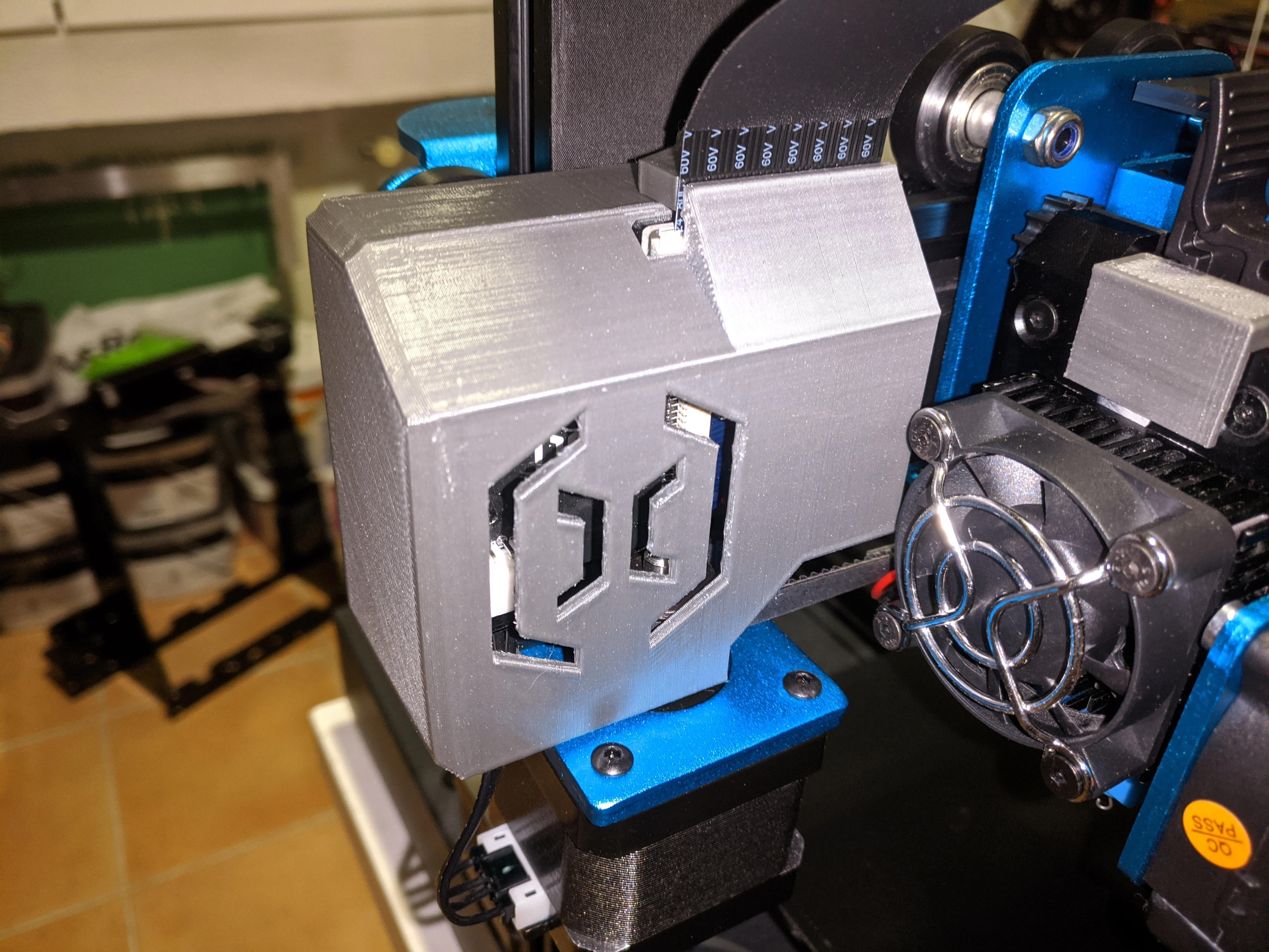 Artillery X1 cover for X-Axis with ribbon hold and strain relief.