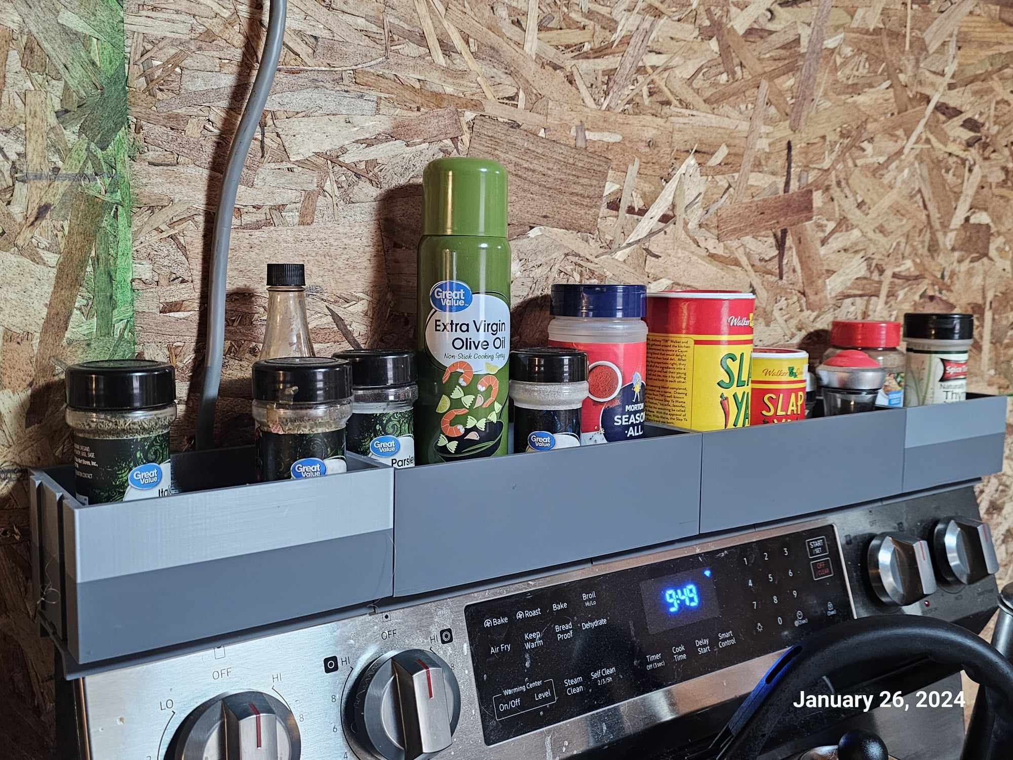 Magnetic spice rack for the back of an oven