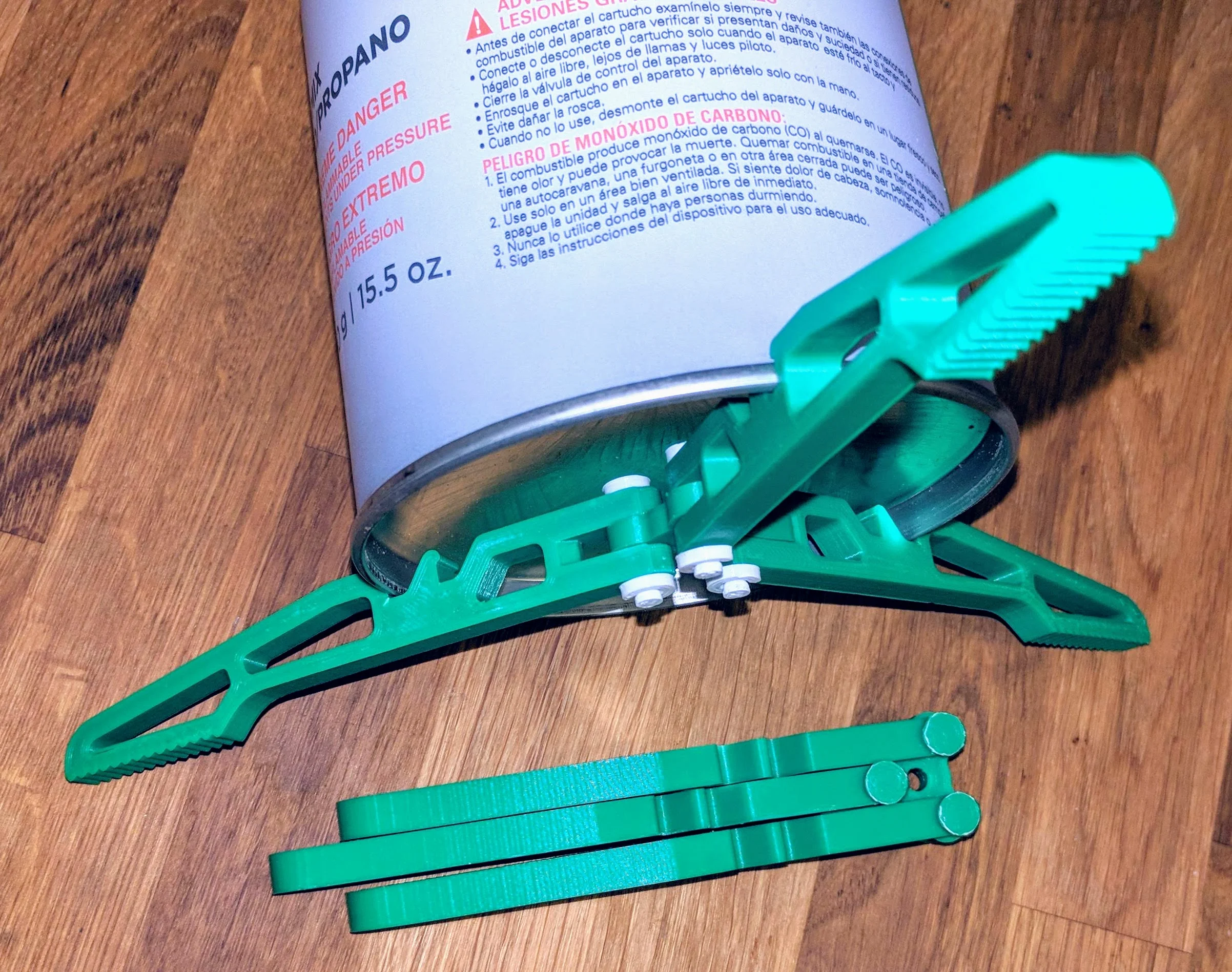 Isobutane camping stove stand with pin fasteners & cap