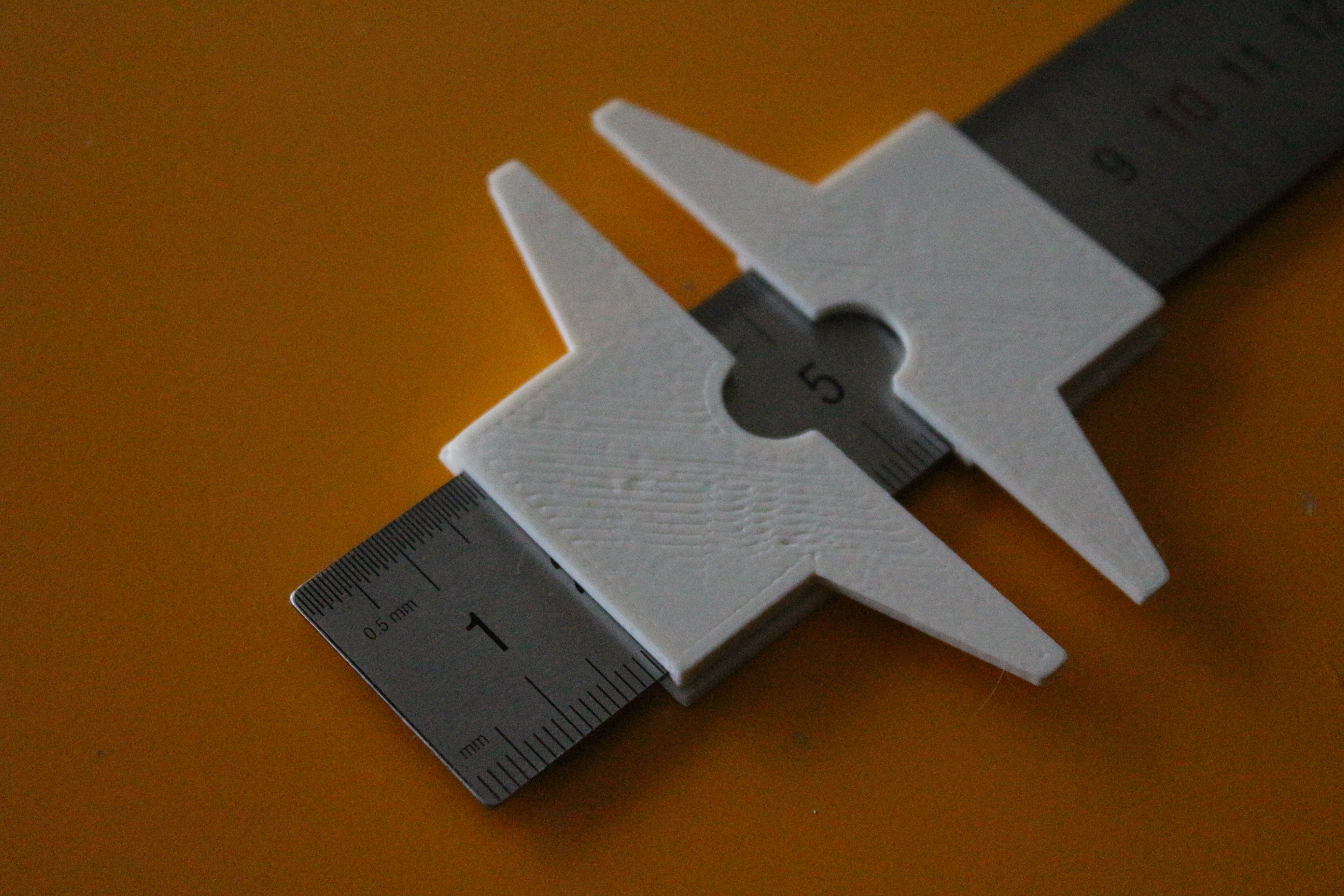 Caliper for steel ruler