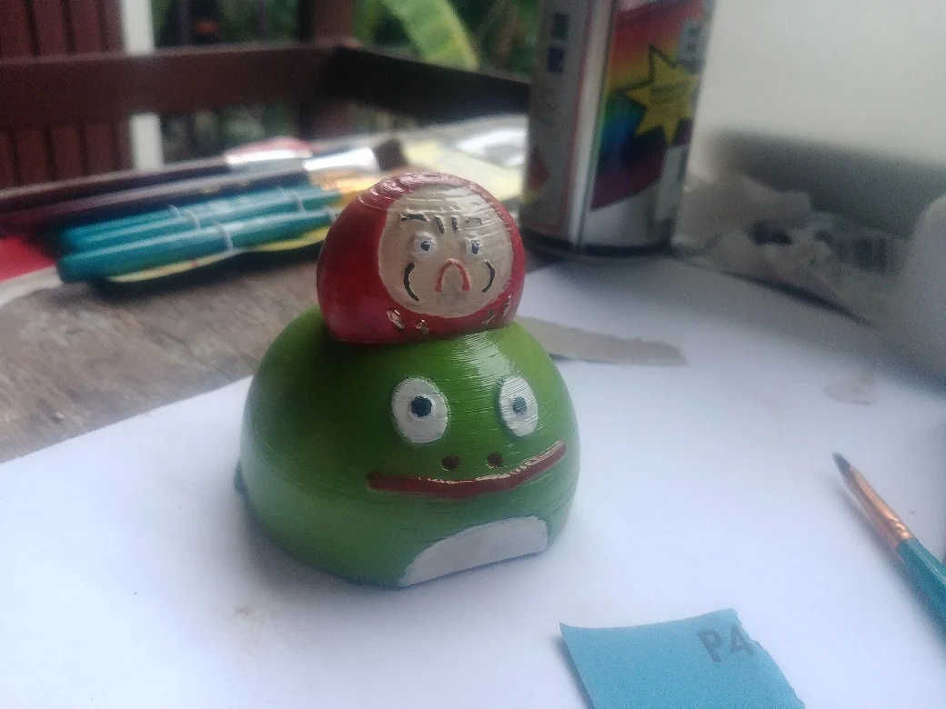 Daruma on a Frog