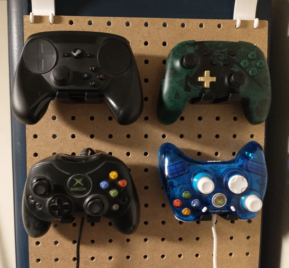 Pegboard game controller holder