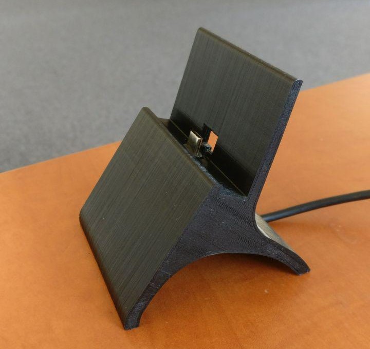 Phone stand with charging calbel slot