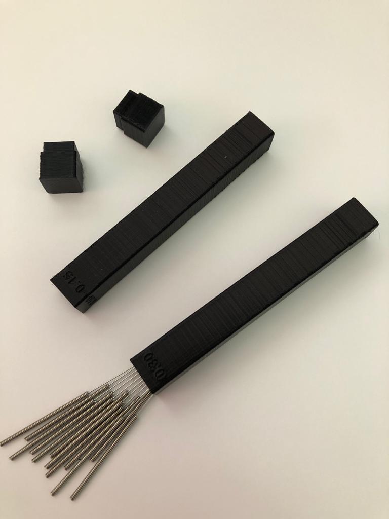 Nozzle cleanup needle box