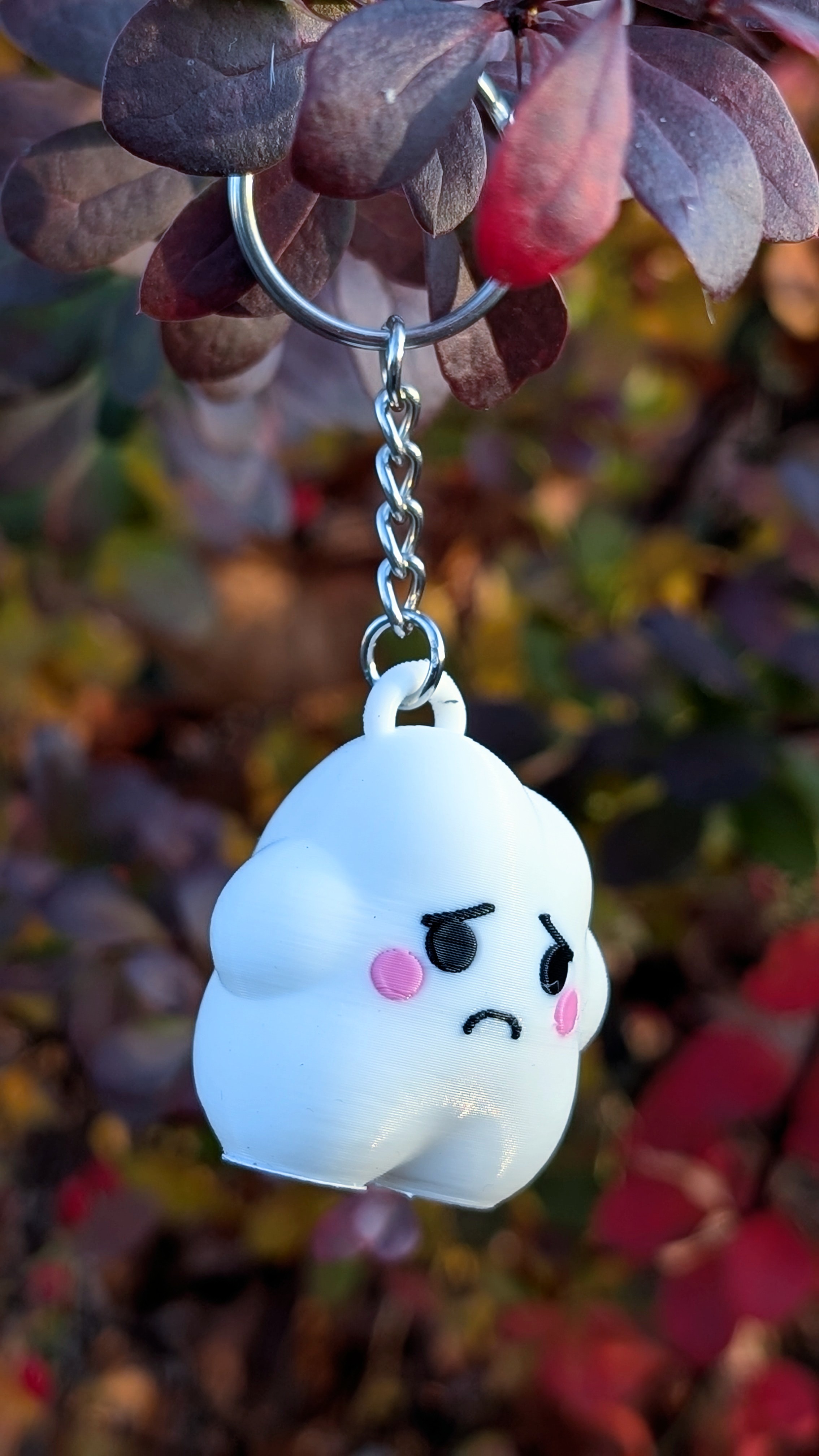 Claude, the sad cloud keychain version