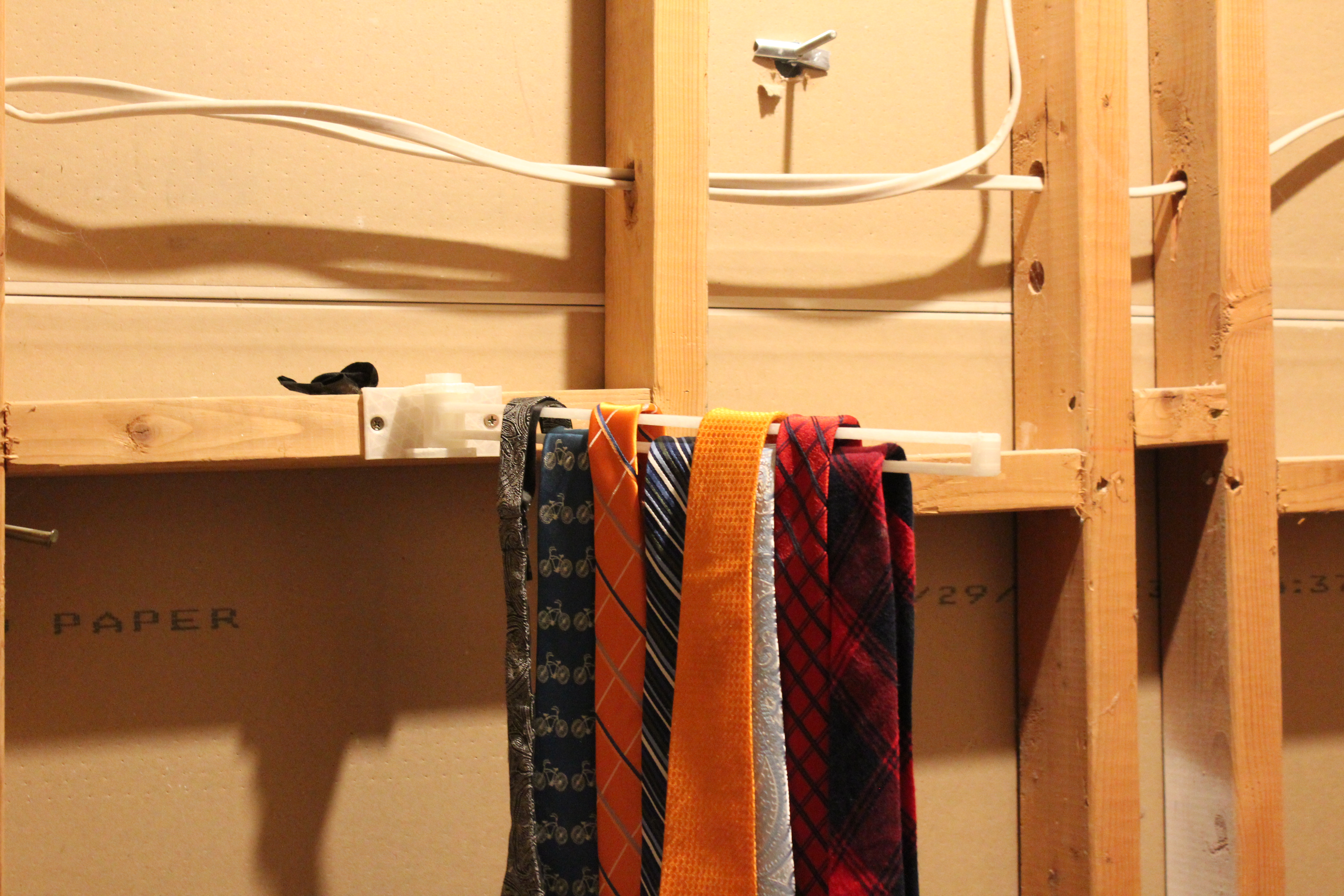 swing arm tie rack