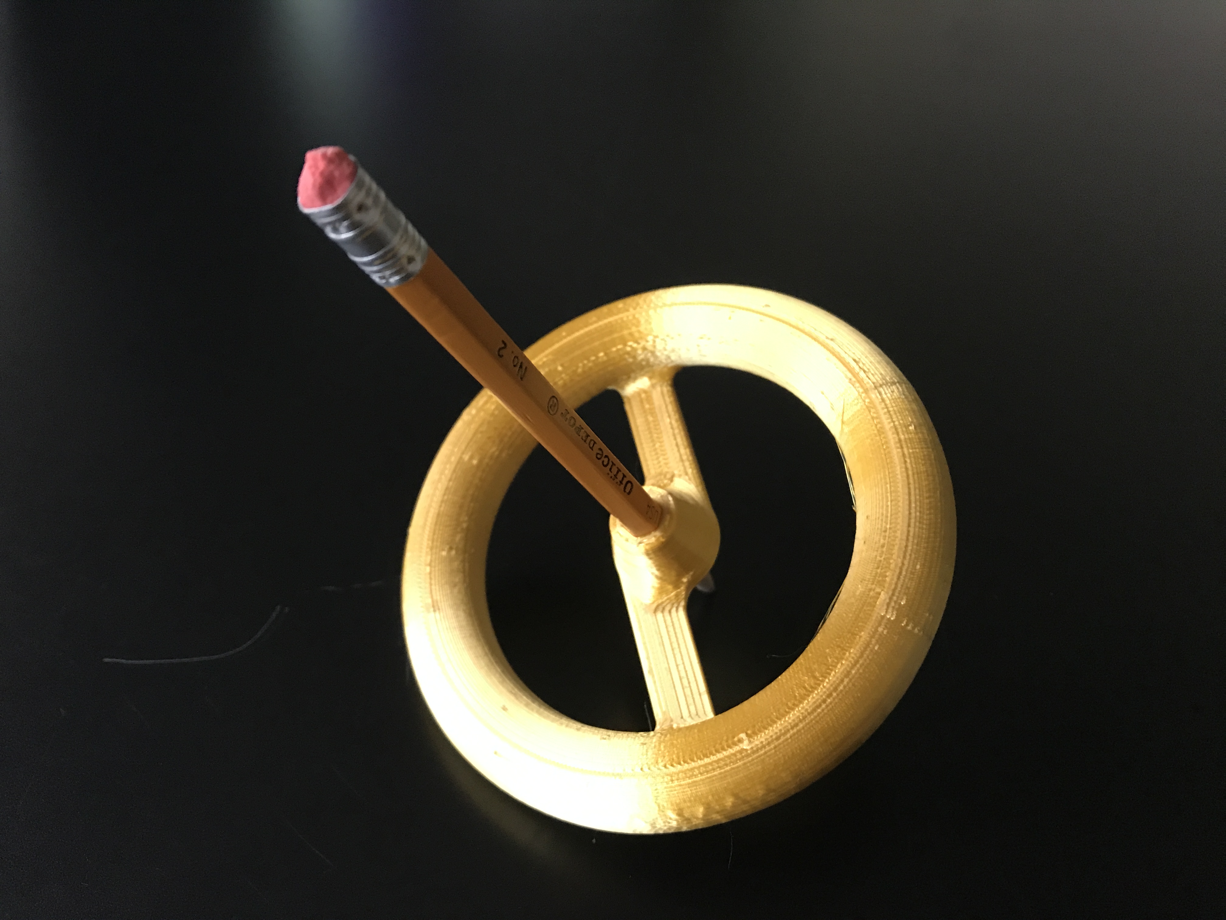 Spinning top with wooden pencil