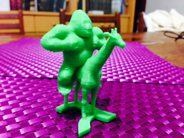 Gorilla riding a giraffe on the letter gimmel