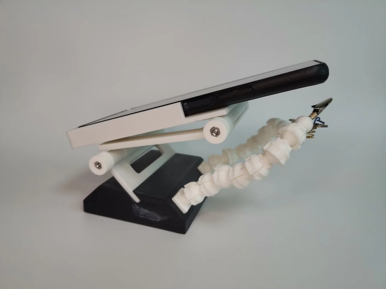 Helping Hands (Third Hands) with Magnifier using a smartphone to magnify