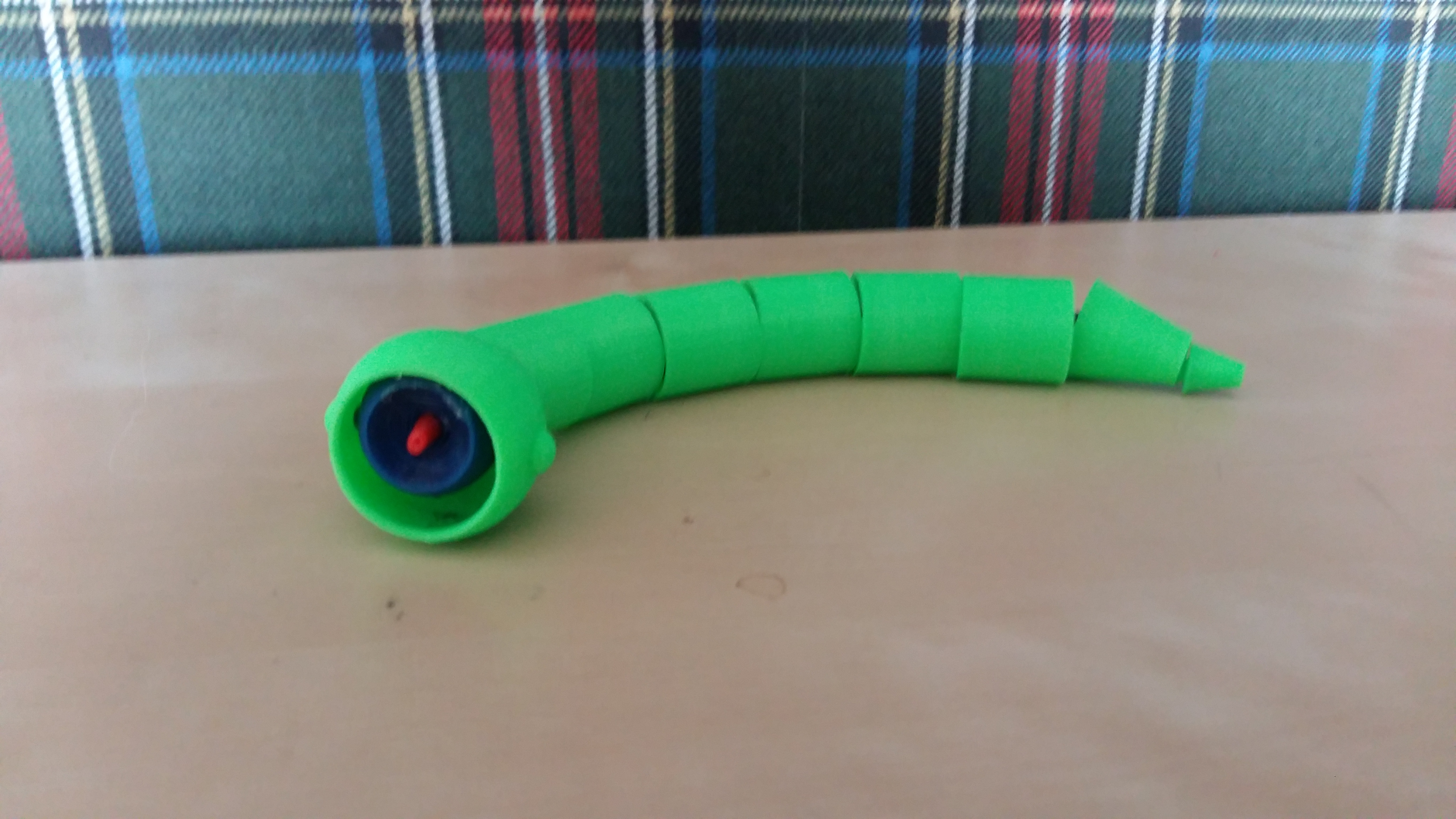 Big snake eats small snake toy