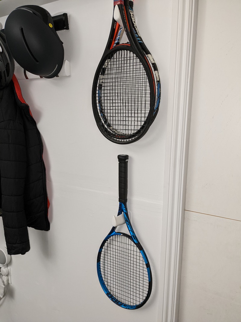 Tennis racket holder wall mounted