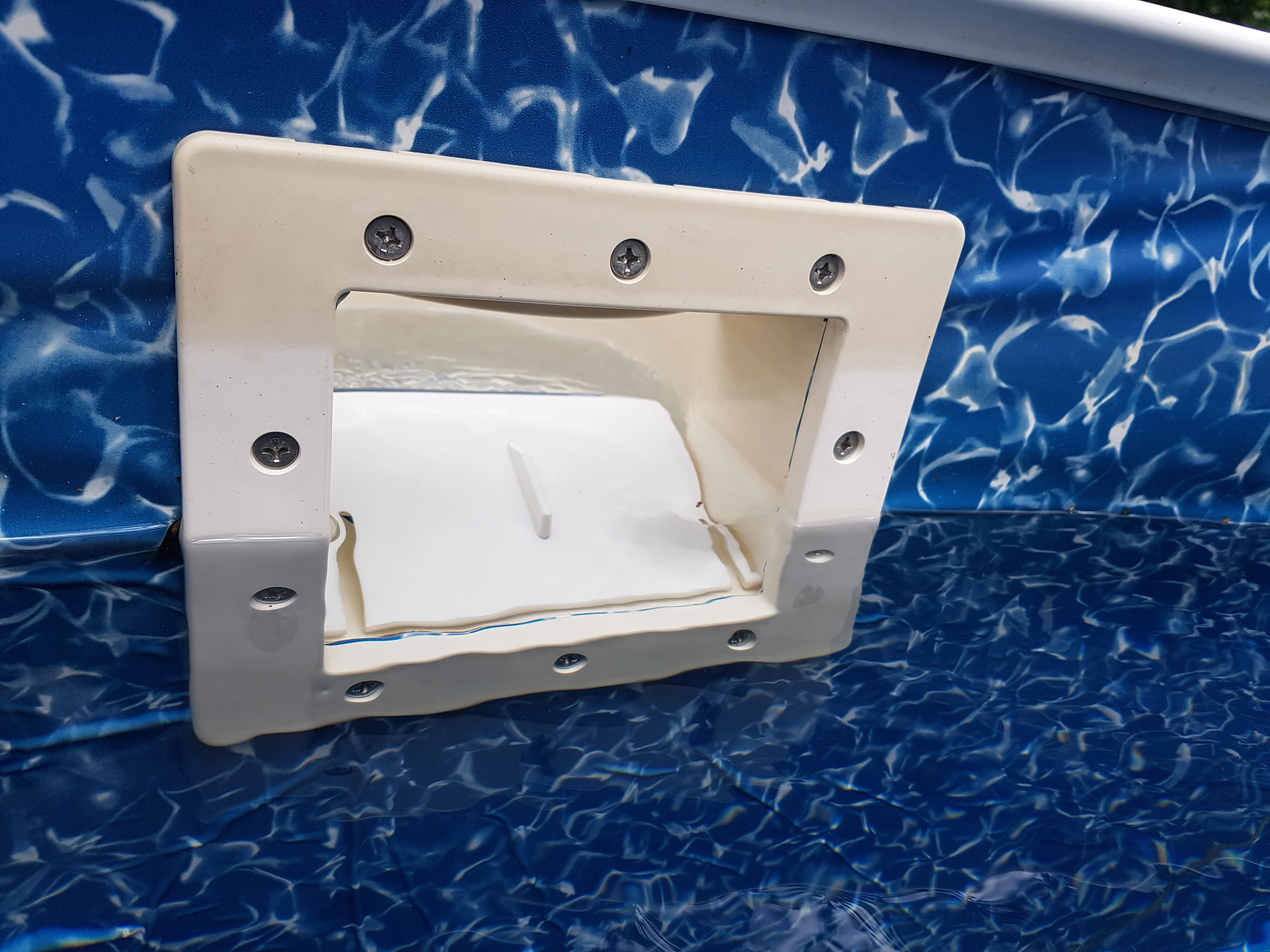 Pool skimmer door