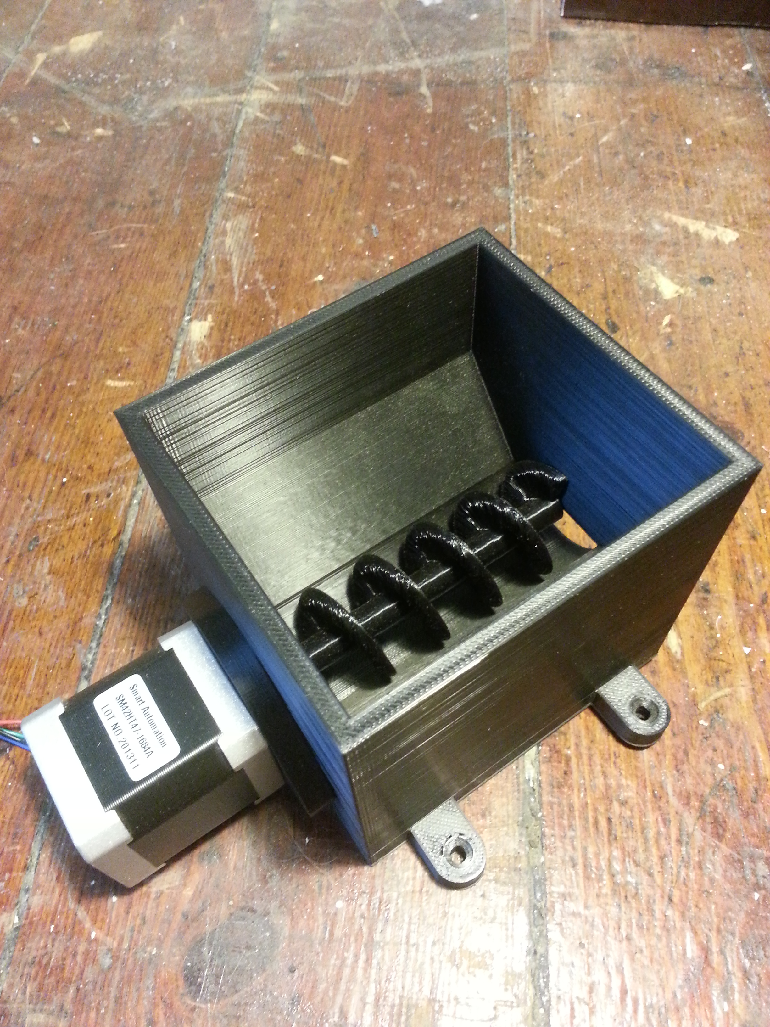 Auger-based feeder for animals, fish etc using Nema 17 stepper motor