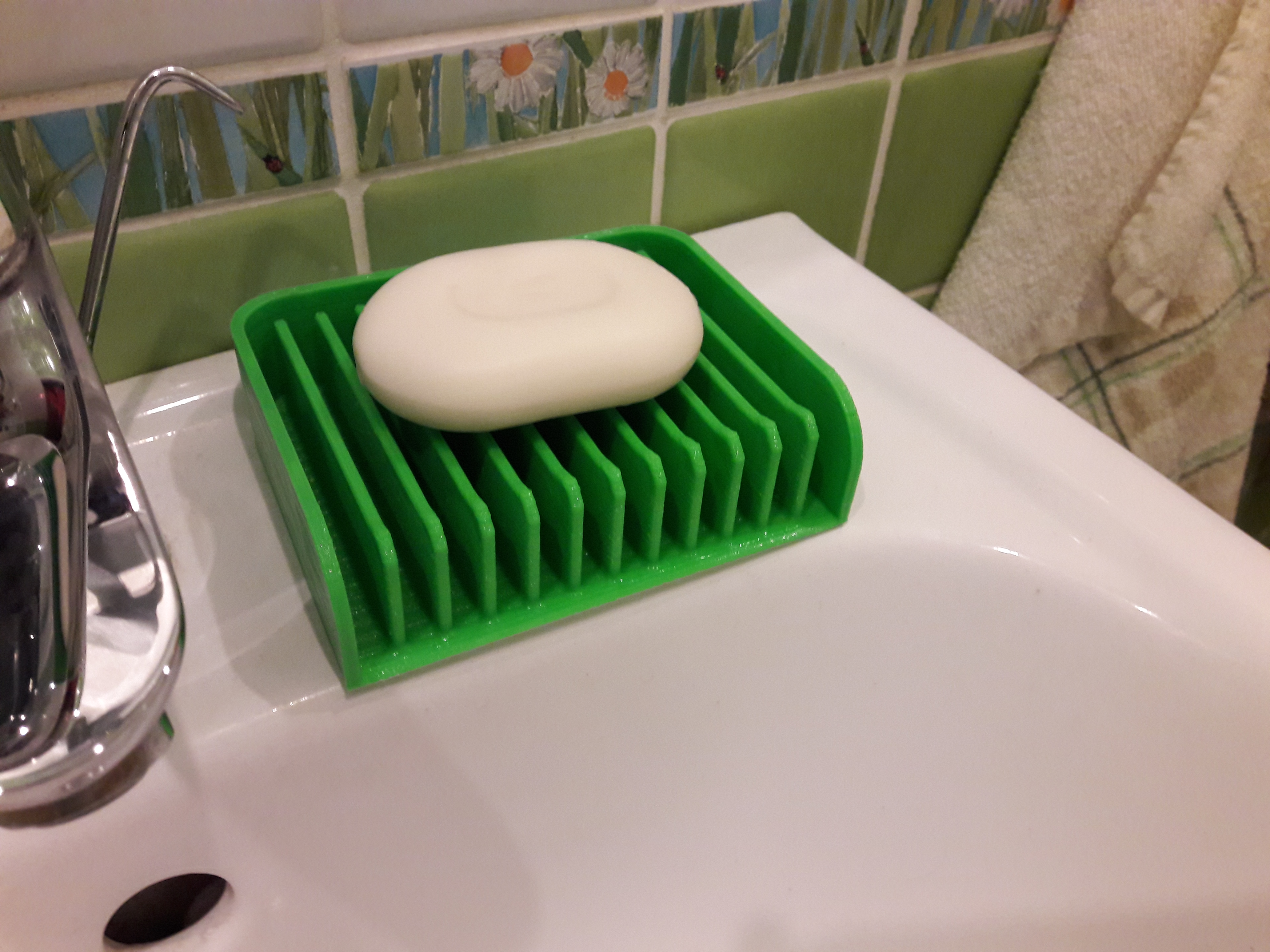 Soap holder with water drain