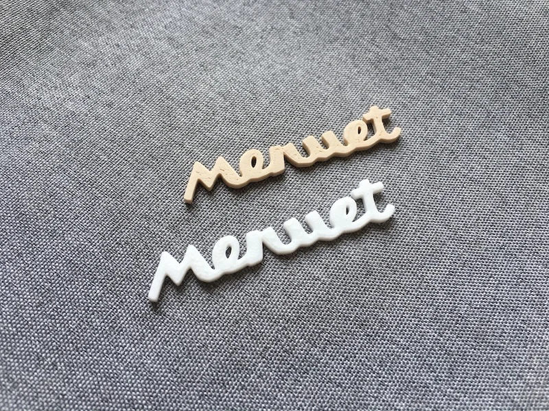 Emblemat Diora Menuet