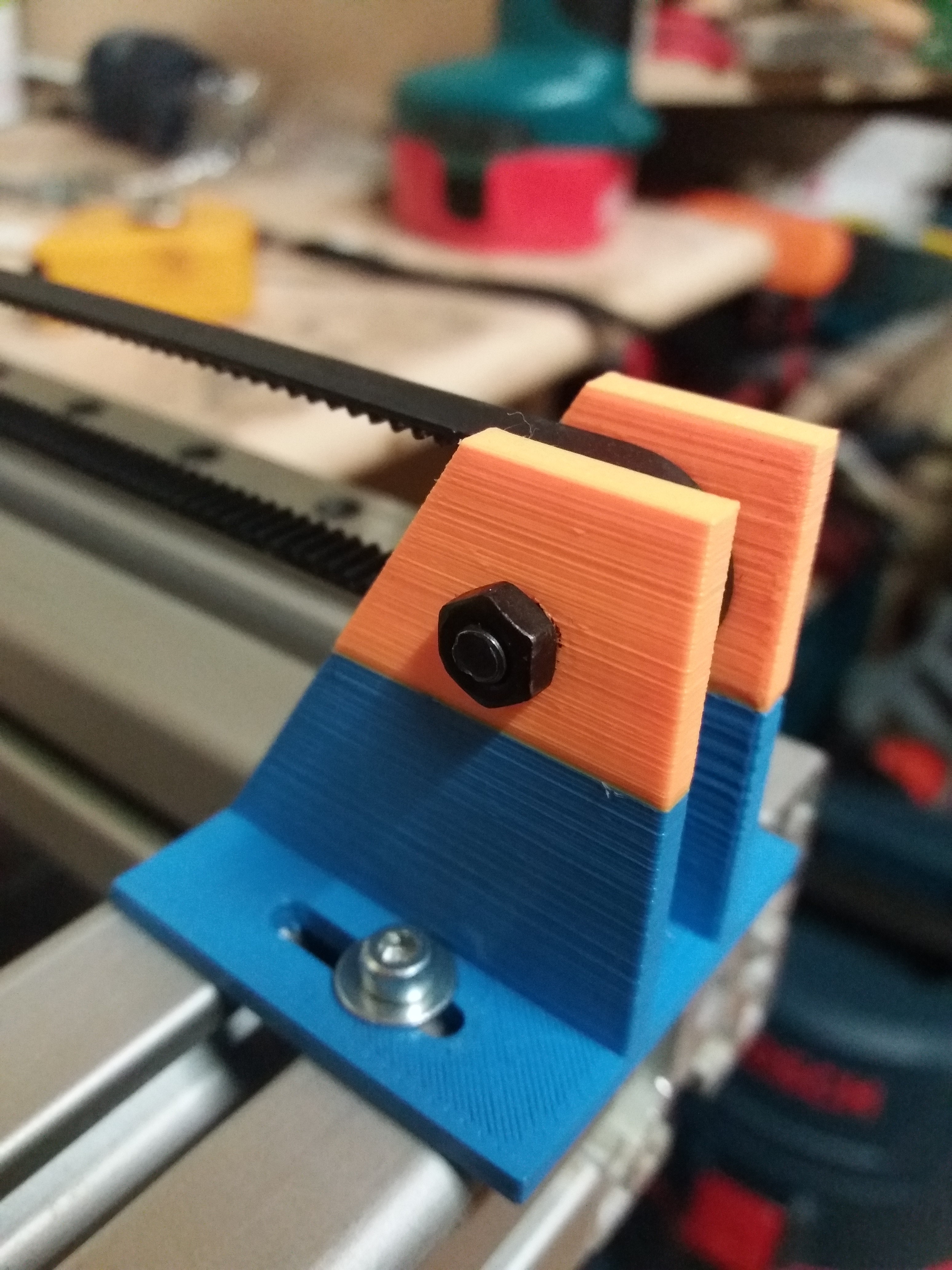 Tensioner - belt carrier