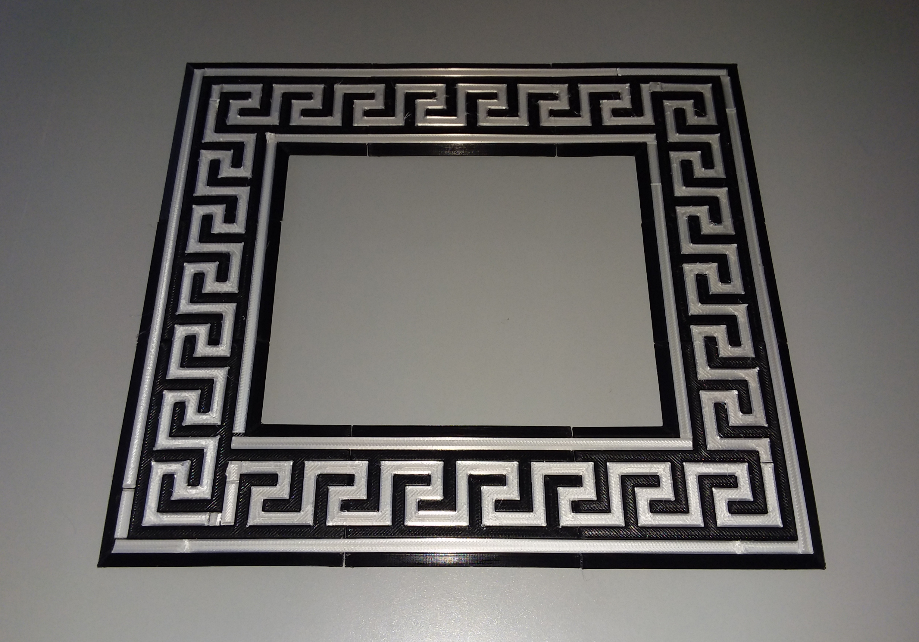 Customizable, interlocking Greek key inset frame