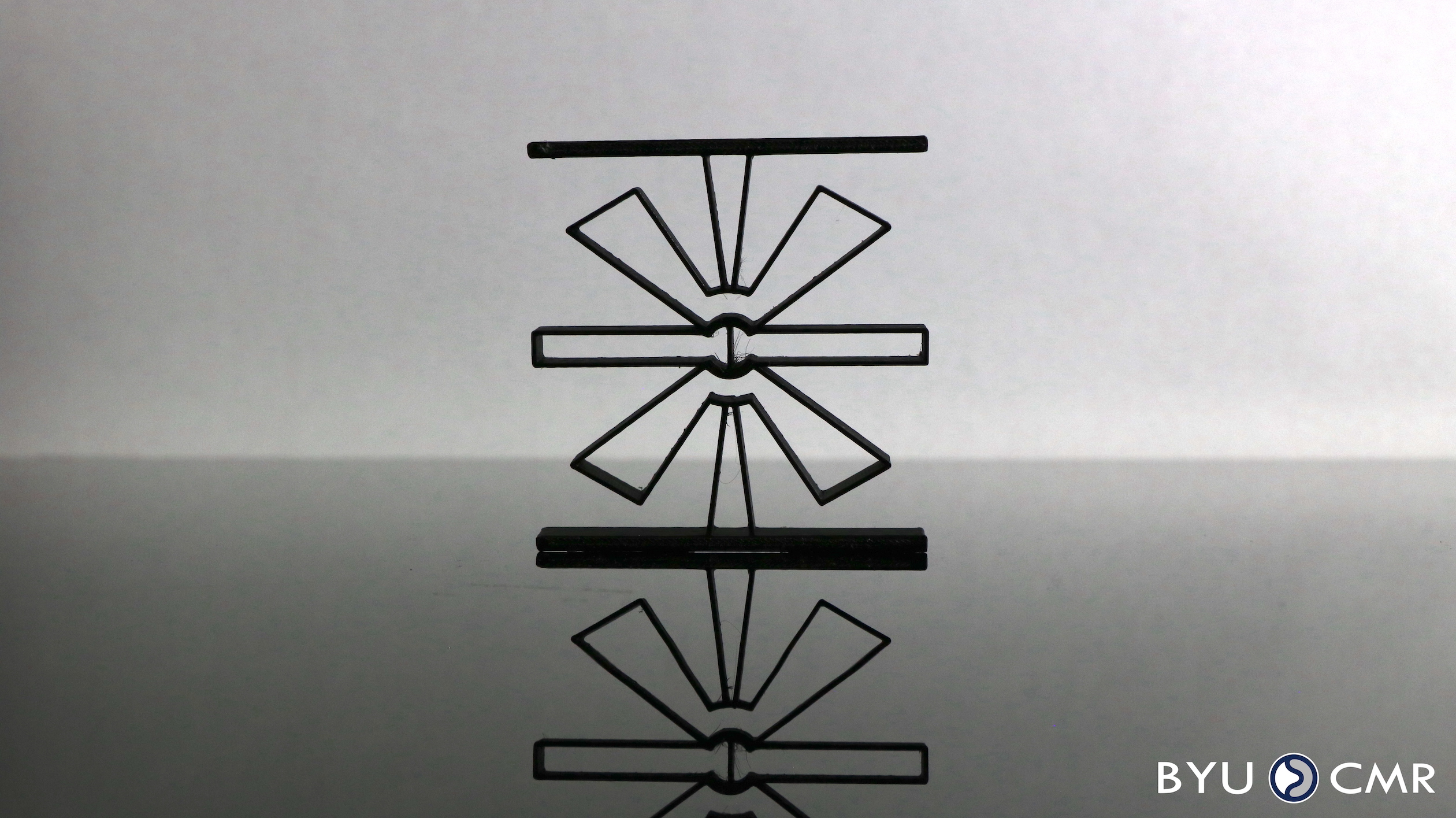 Flex-16: Large-Displacement Monolithic Compliant Rotational Hinge