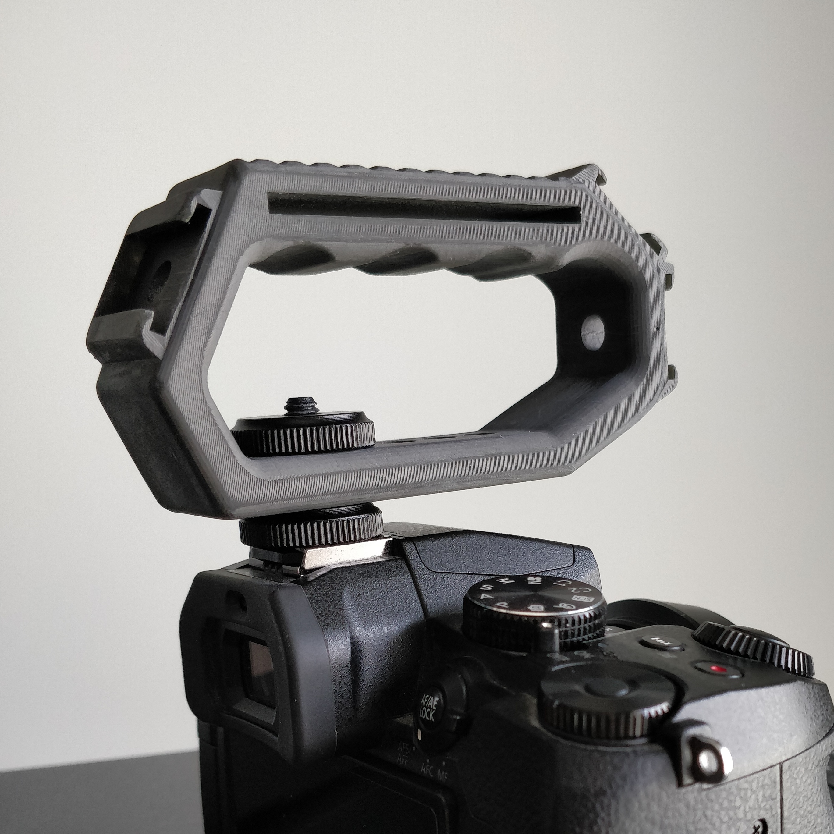 Camera Top Handle Grip (more hot shoe mounting points, less volume - it's smaller)