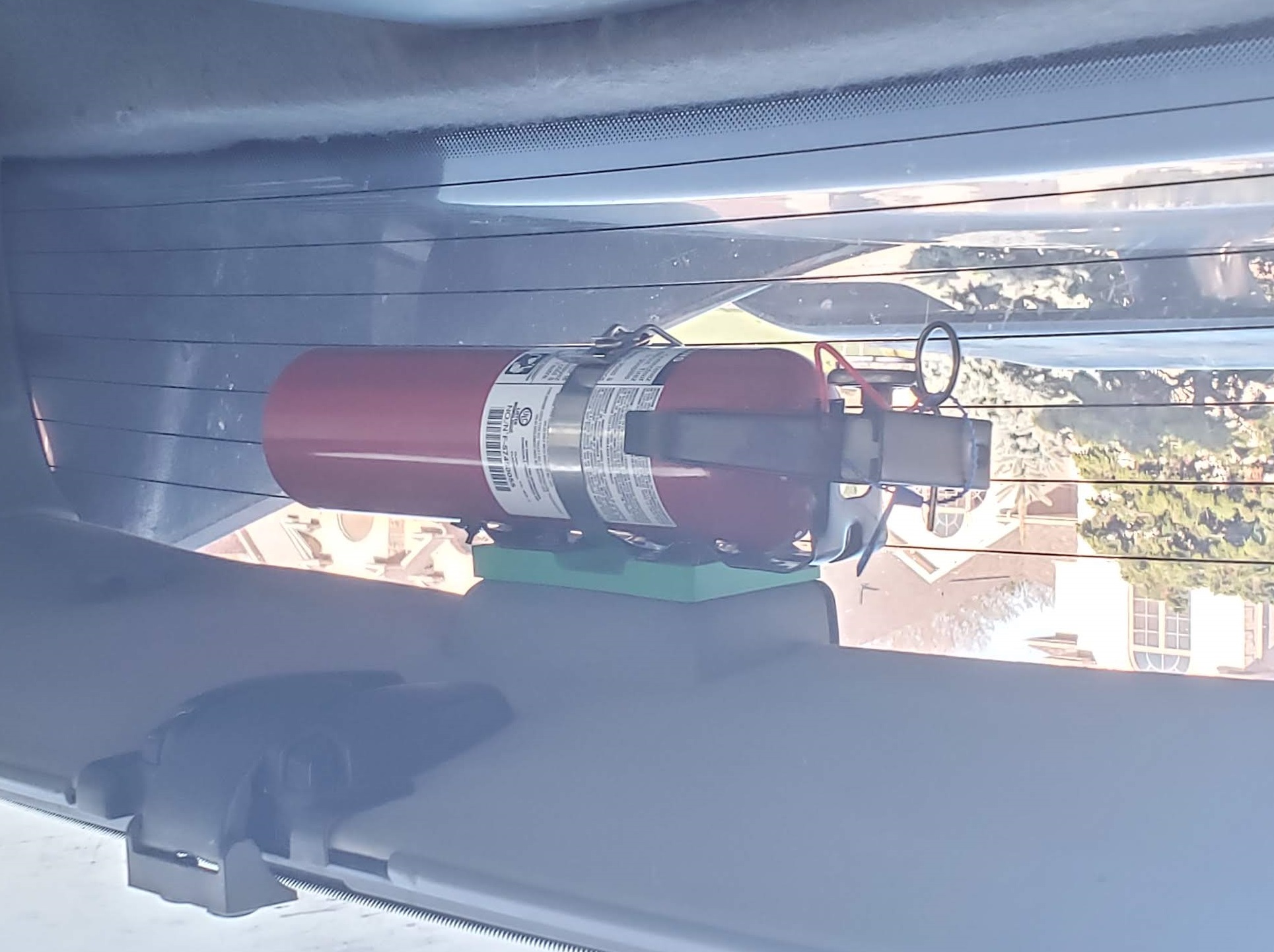 Fire extinguisher mount for Pontiac Fiero