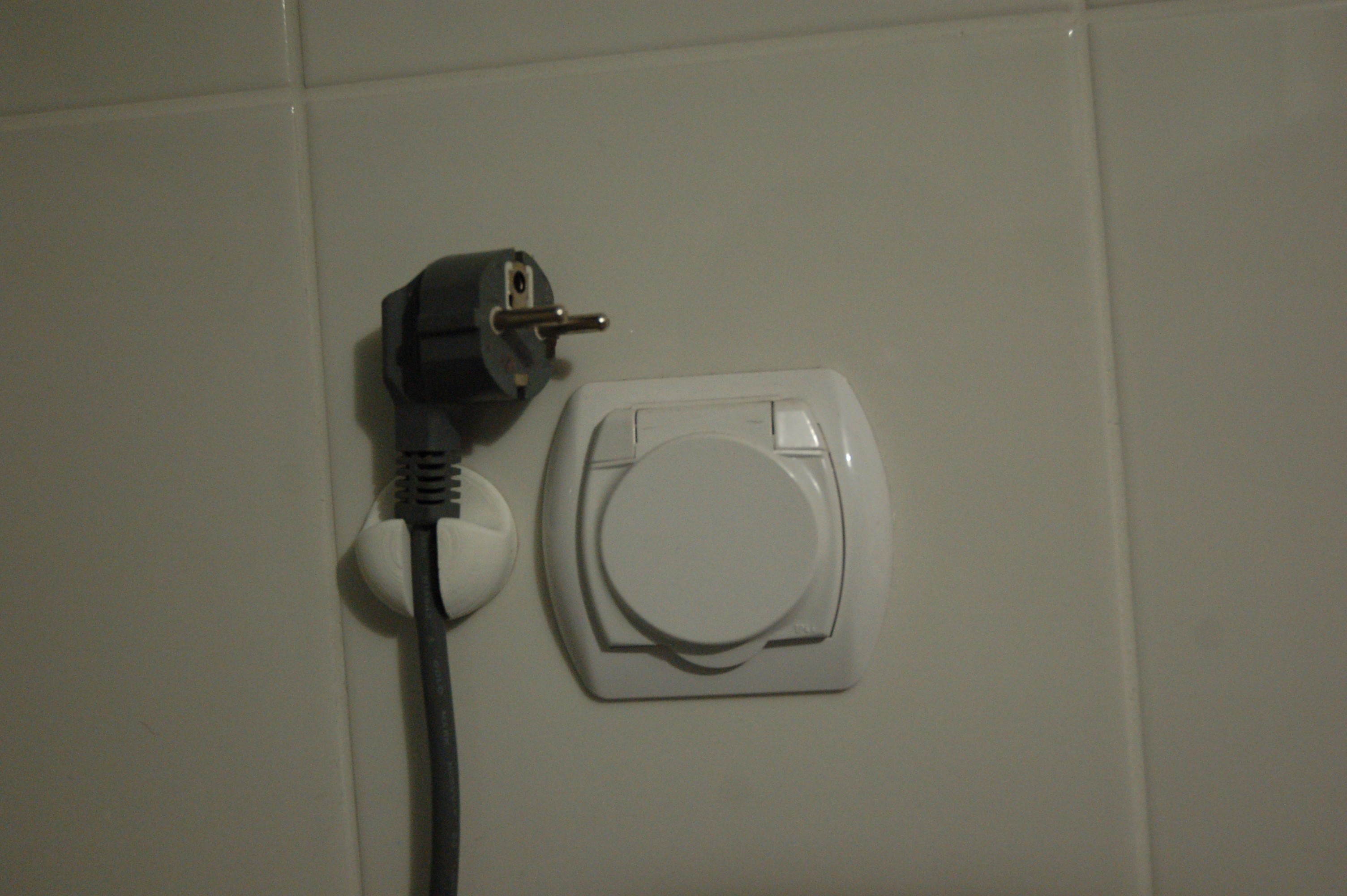 Power plug wall hanger