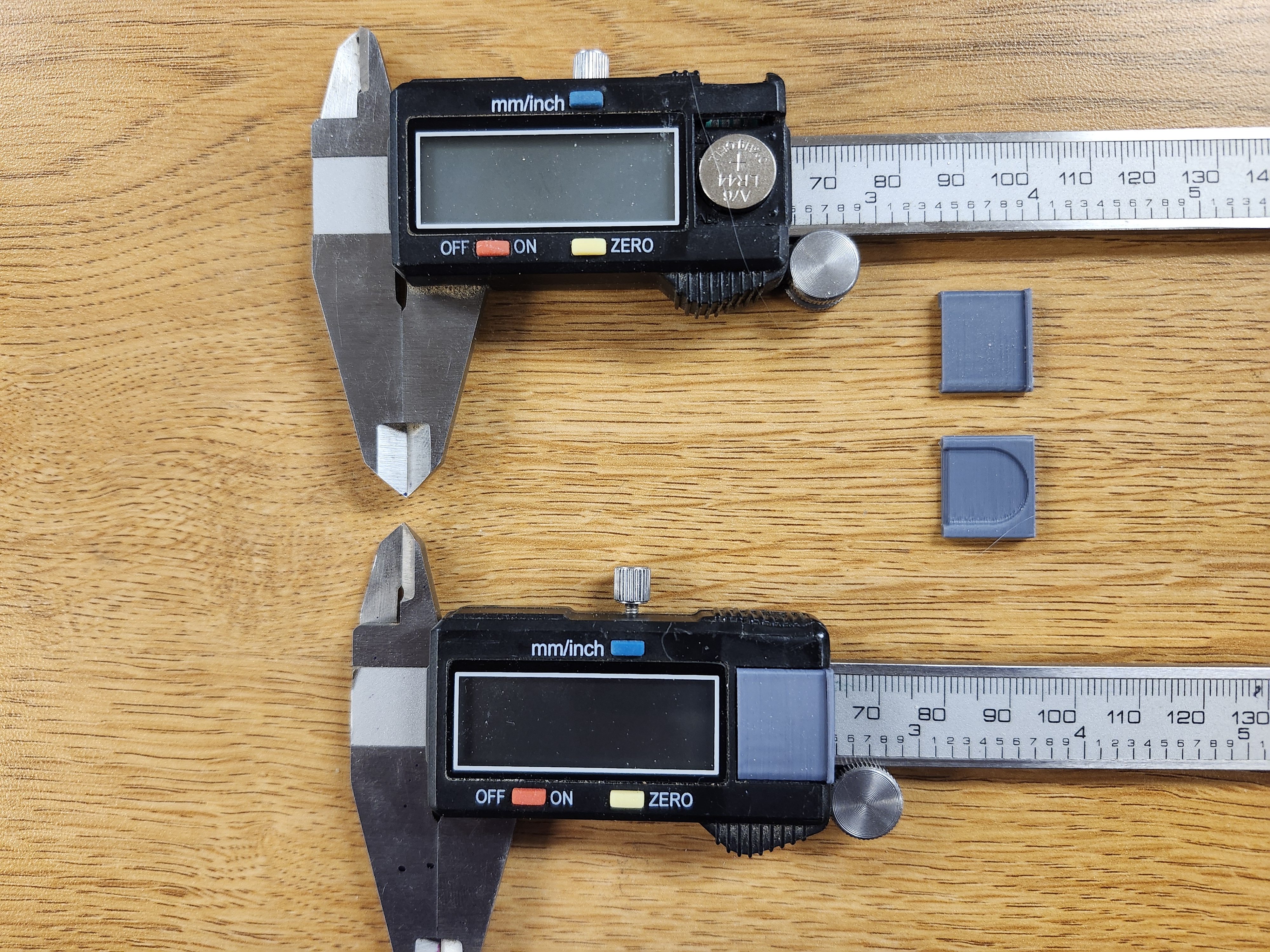 Slide battery cover for digital calipers