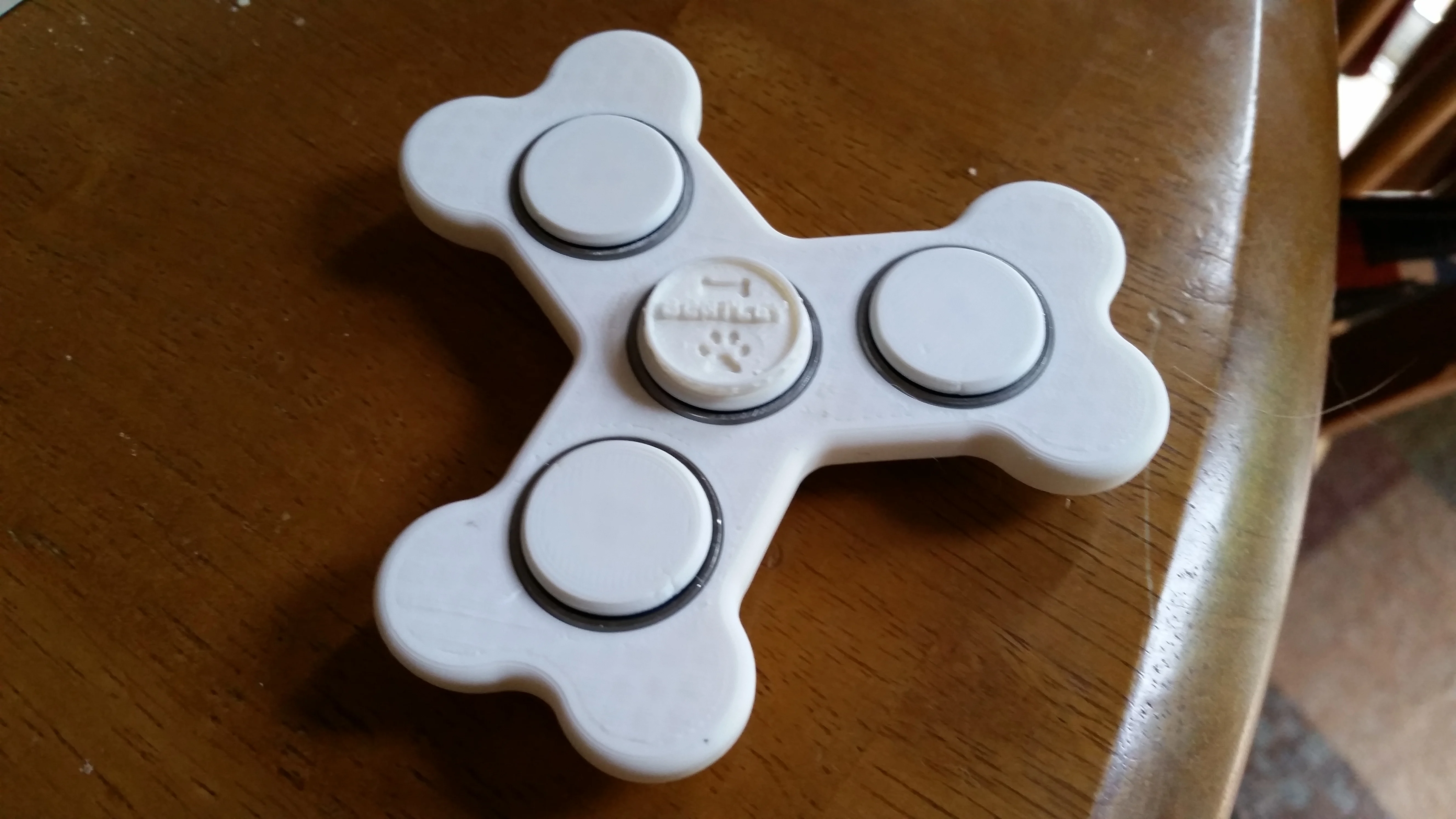Bone fidget spinner with Bentley coin center
