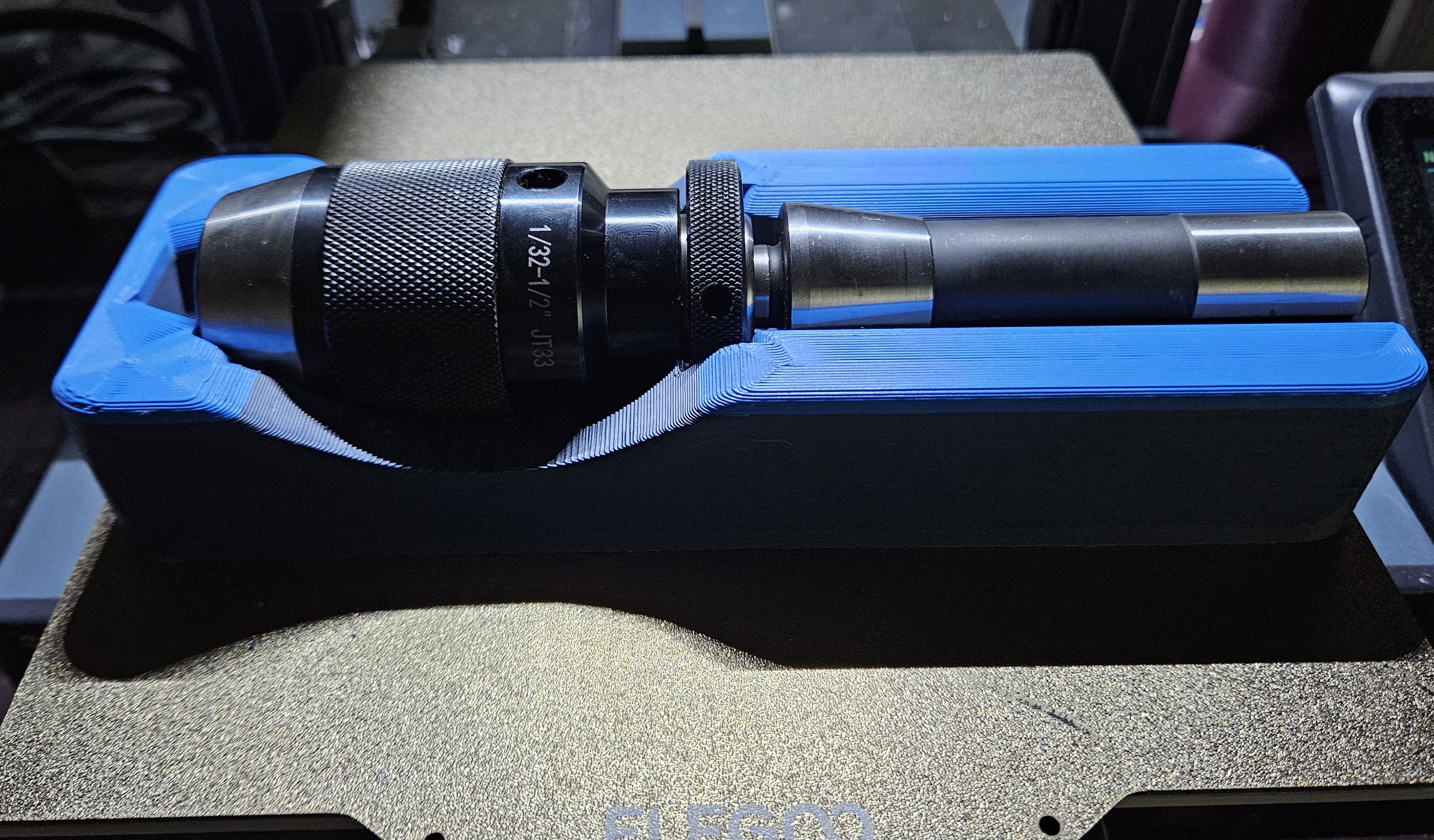 Keyless drill chuck with JT33 to r8 adapter affixed.