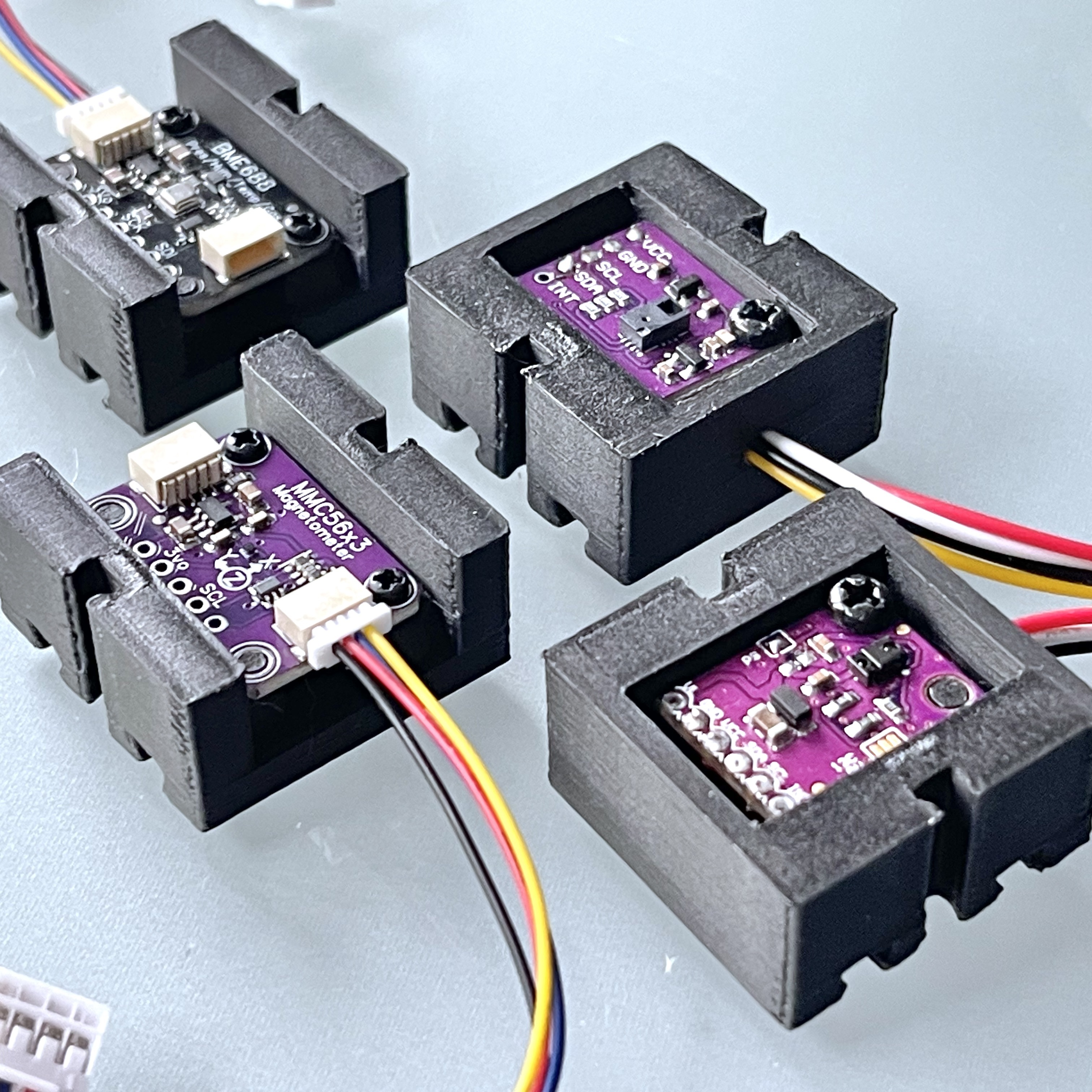 Various small sensor enclosures for use with fischertechnik