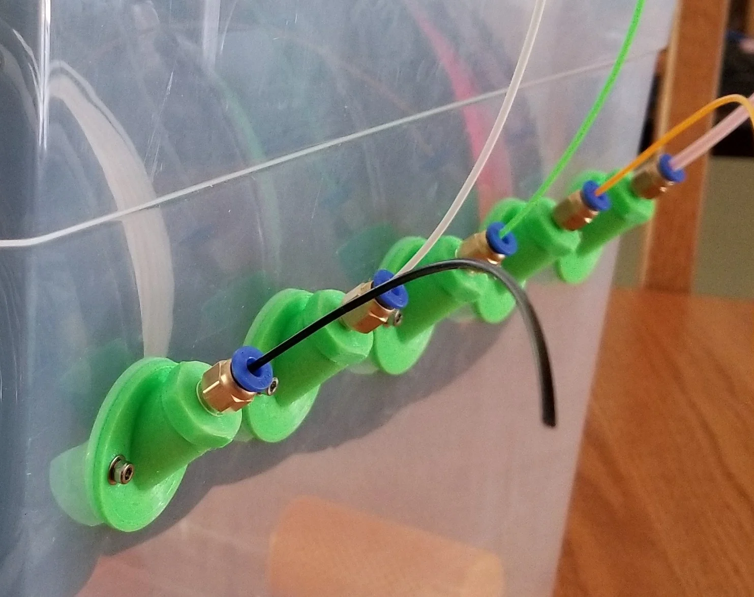Angled dry box filament guide