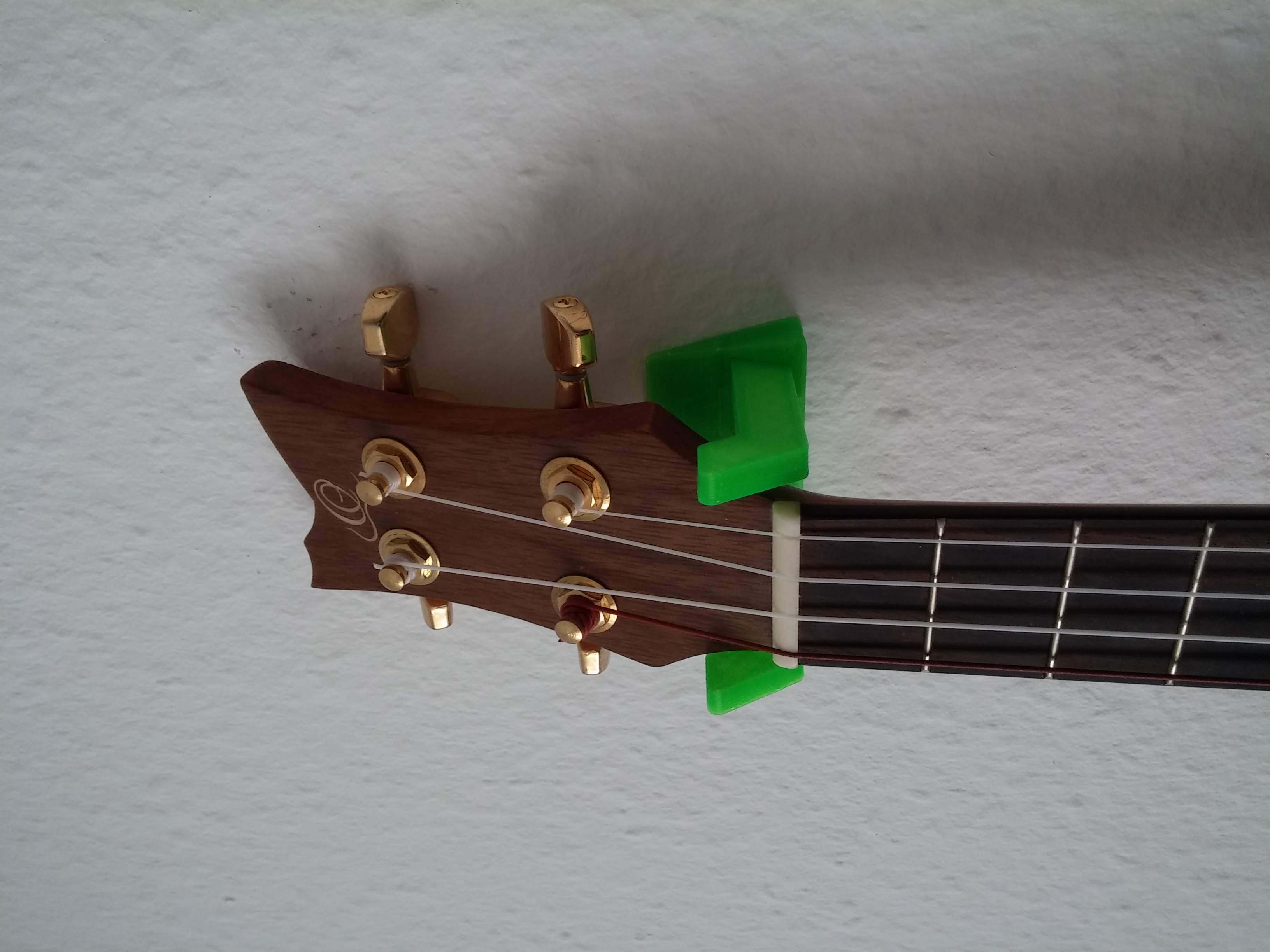 Ukulele wall mount with single screw