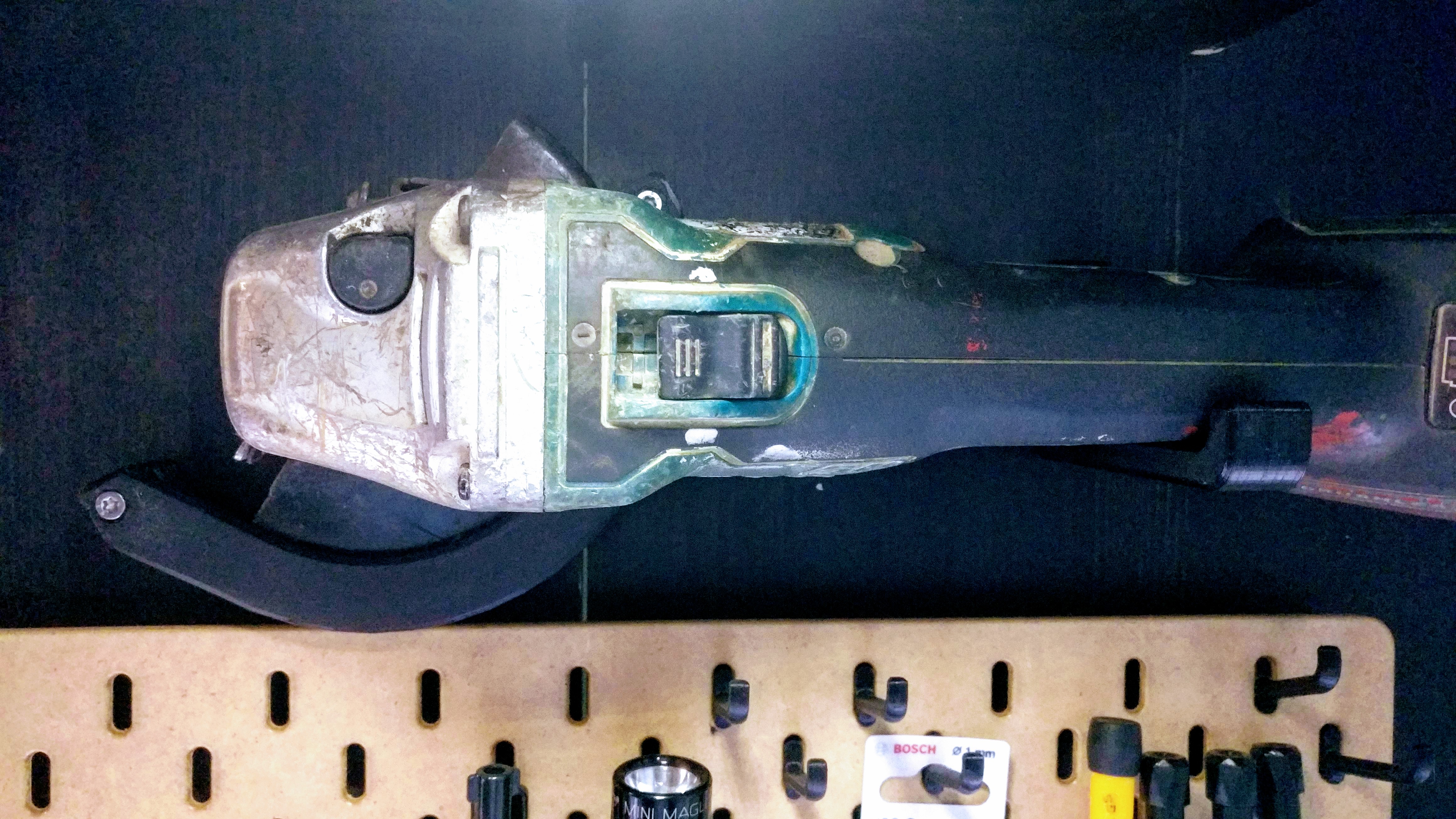 Angle grinder wall holder