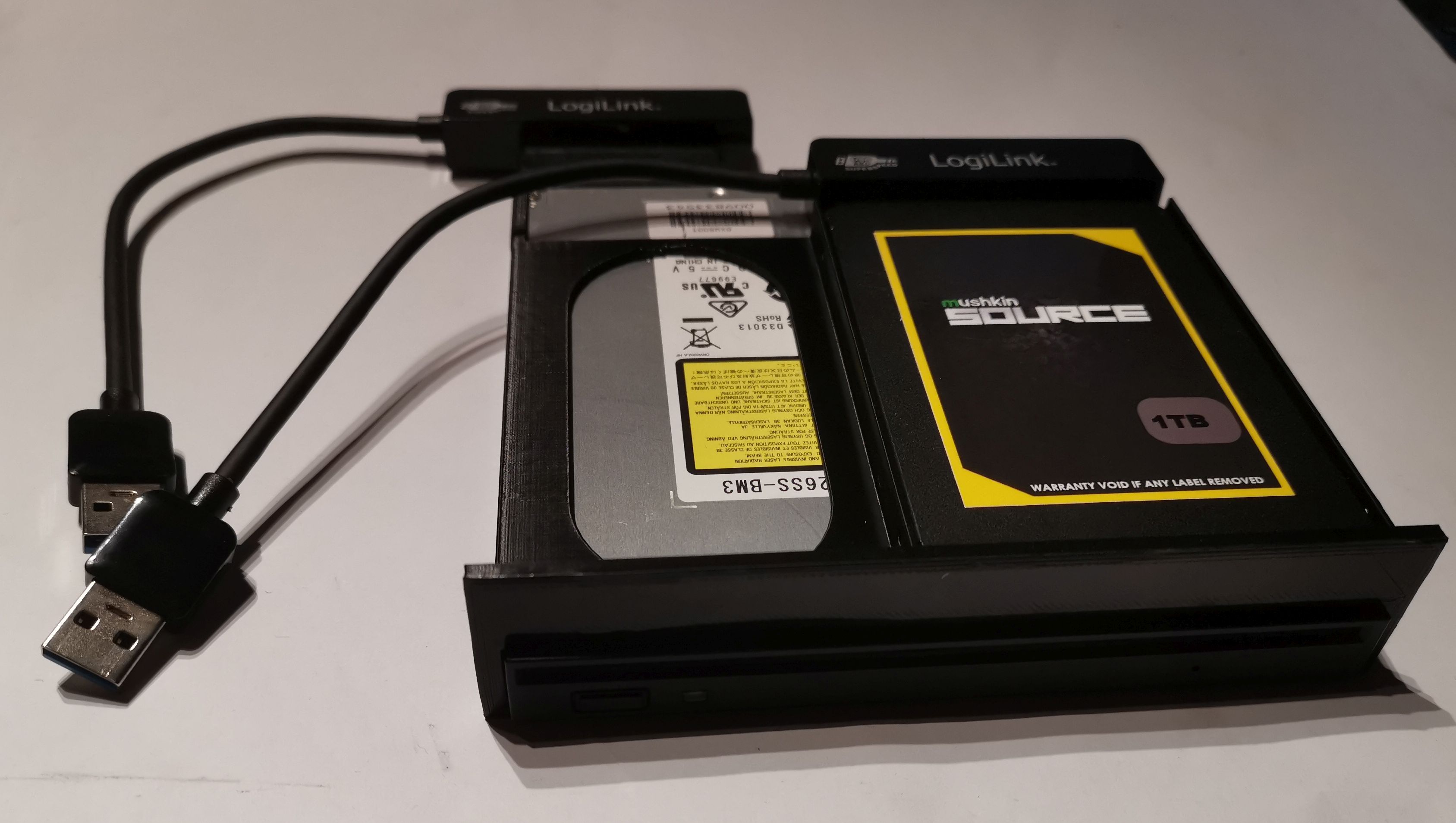Frame for slim-line DVD/BluRay and SSD