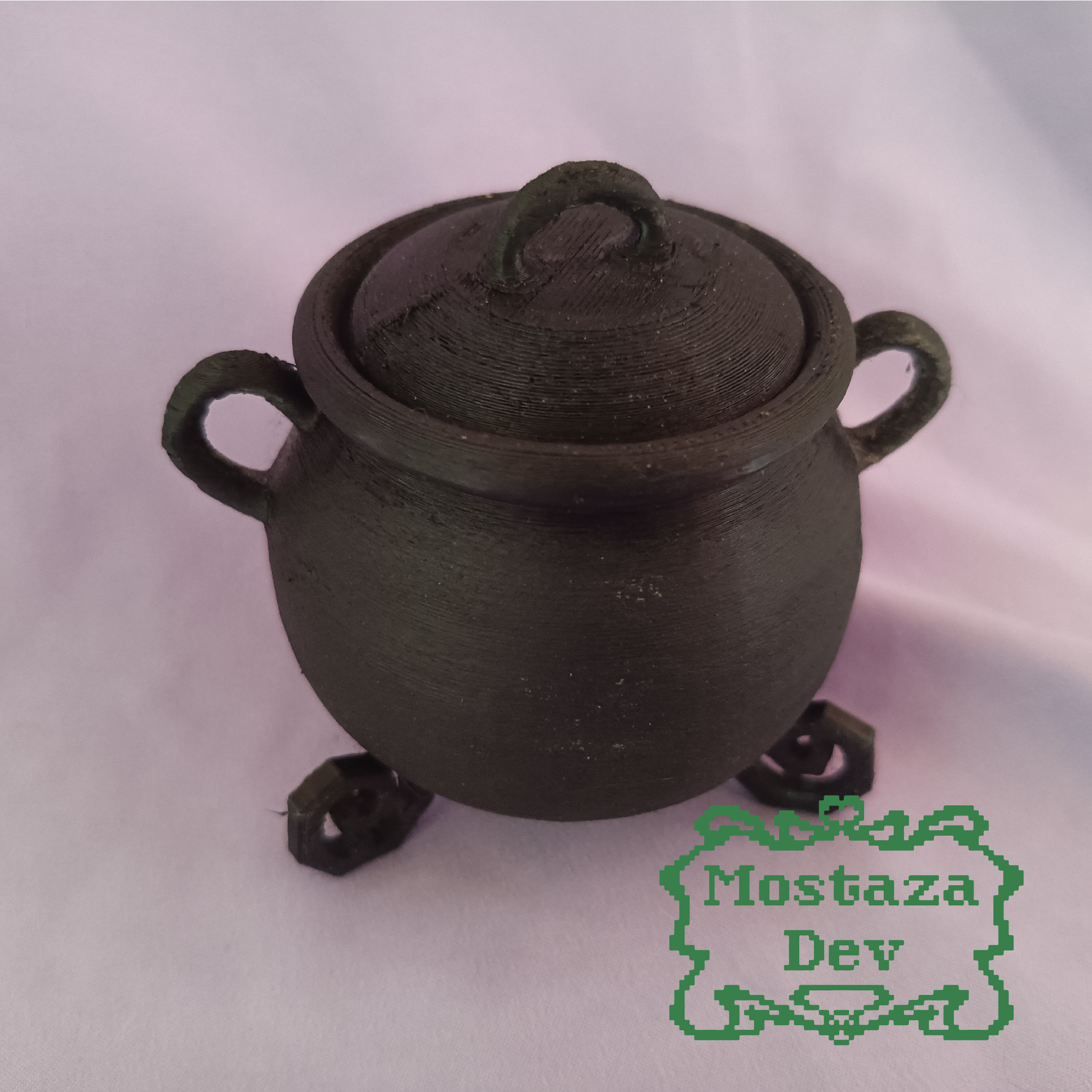 Cauldron with lid and handles.